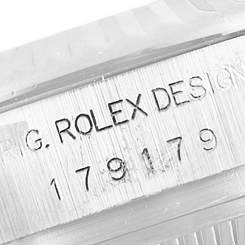 This image shows a close-up of the engraved serial number on the case of a Rolex President 179179 Women's White Gold Silver Dial 179179 Women's White Gold Silver Dial model watch.