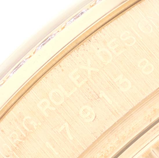 Close-up of the engraved serial number and brand name on the case side of the Rolex President 179138 Women's Yellow Gold Champagne Dial 179138 Women's Yellow Gold Champagne Dial watch.