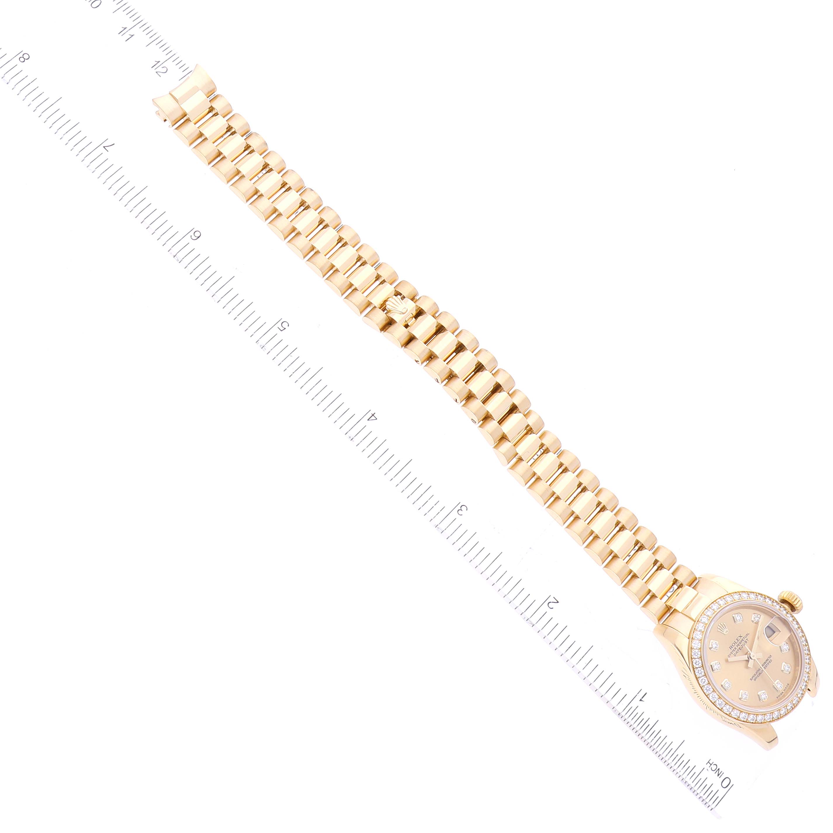 The image shows the entire Rolex President 179138 Women's Yellow Gold Champagne Dial 179138 Women's Yellow Gold Champagne Dial model watch, including its face, dial, crown, and full metal bracelet.