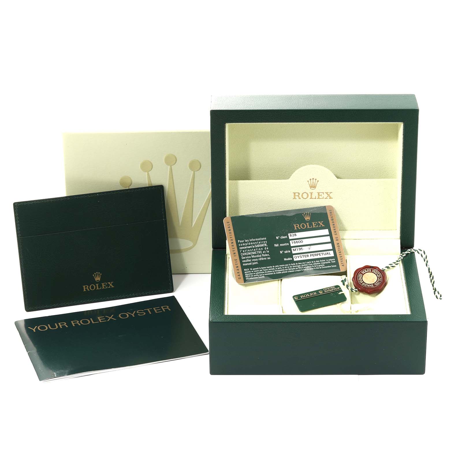The image shows the packaging and accessories of a Rolex Sea-Dweller 16600 Men
s Stainless Steel Black Dial 16600 Men
s Stainless Steel Black Dial, including the box, tags, warranty card, and booklets.