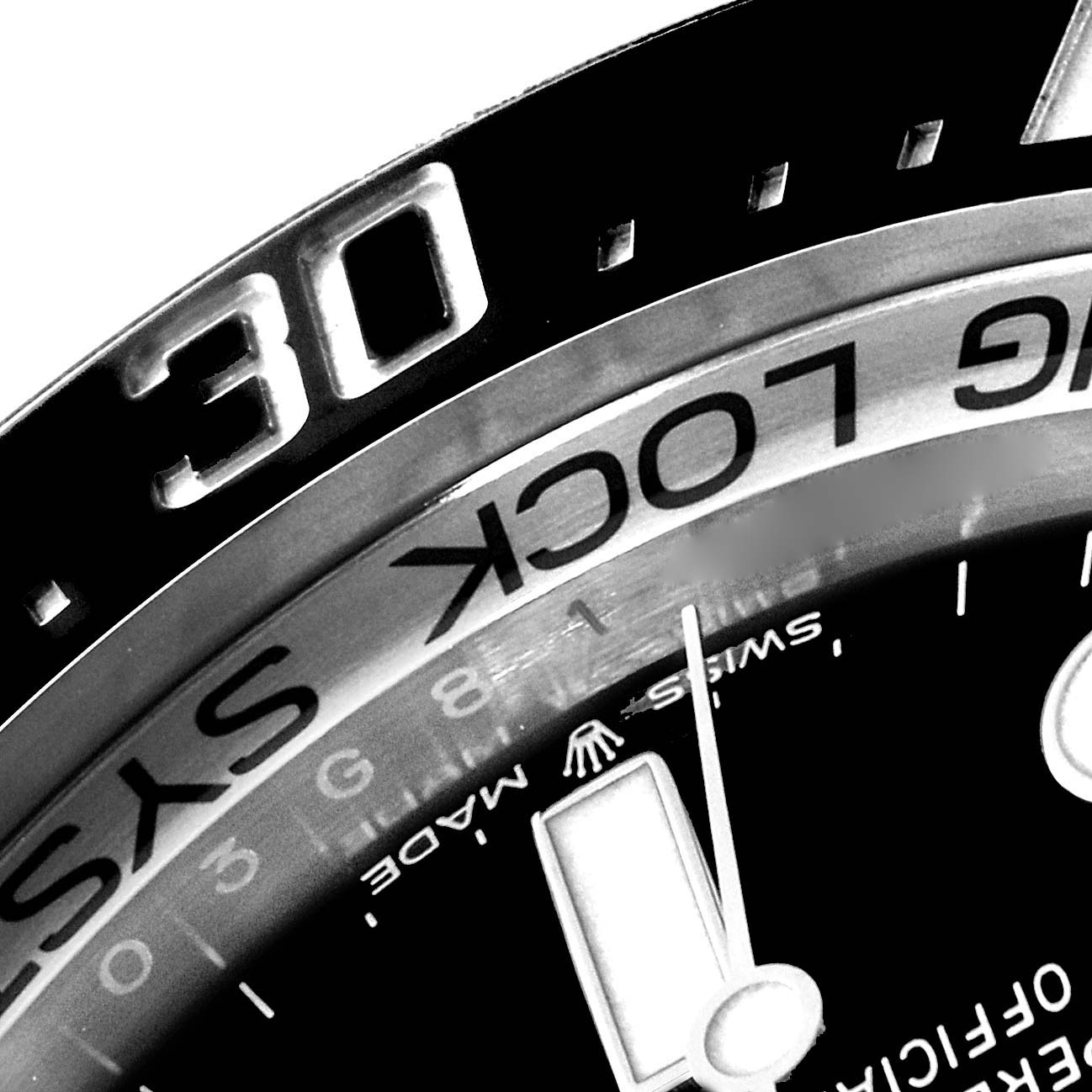 Close-up of the bezel and part of the dial of the Rolex Sky-Dweller watch, showing the 30-minute marker.