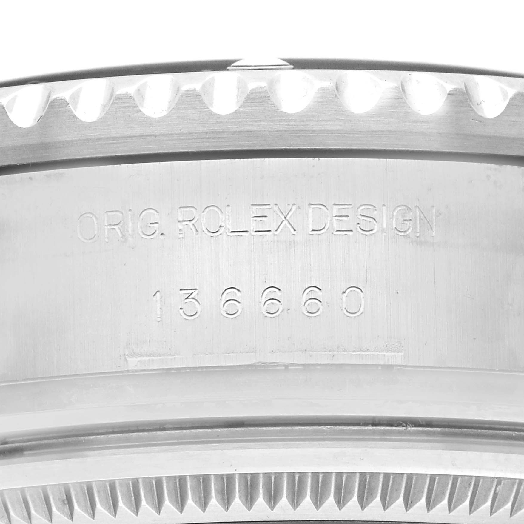 The image shows a close-up of the engraved side of a Rolex Sea-Dweller 136660 Men
s Stainless Steel Blue Dial case with the model number.