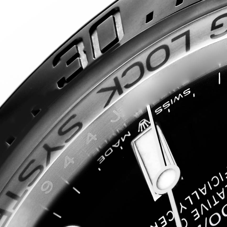 The image shows a close-up of the bezel and dial of a Rolex Sea-Dweller 136660 Men
s Stainless Steel Blue Dial watch, highlighting the "30" marker and part of the dial text.