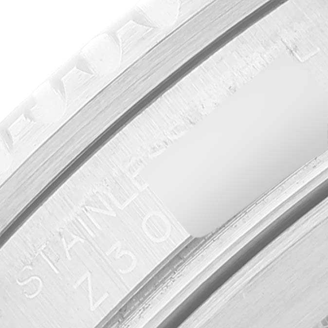 Close-up of the side engraving on the case band of a Rolex Submariner 16610 Men's Stainless Steel Black Dial 16610 Men's Stainless Steel Black Dial watch, showing the stainless steel marking.
