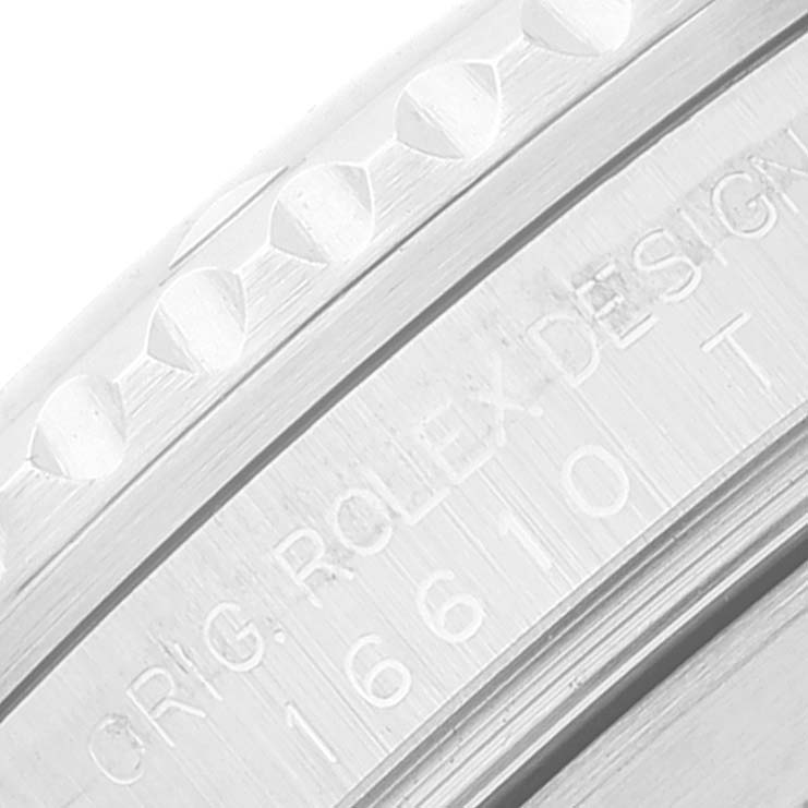 This image shows a close-up of the side engraving on the bezel and case of a Rolex Submariner 16610 Men's Stainless Steel Black Dial 16610 Men's Stainless Steel Black Dial watch.