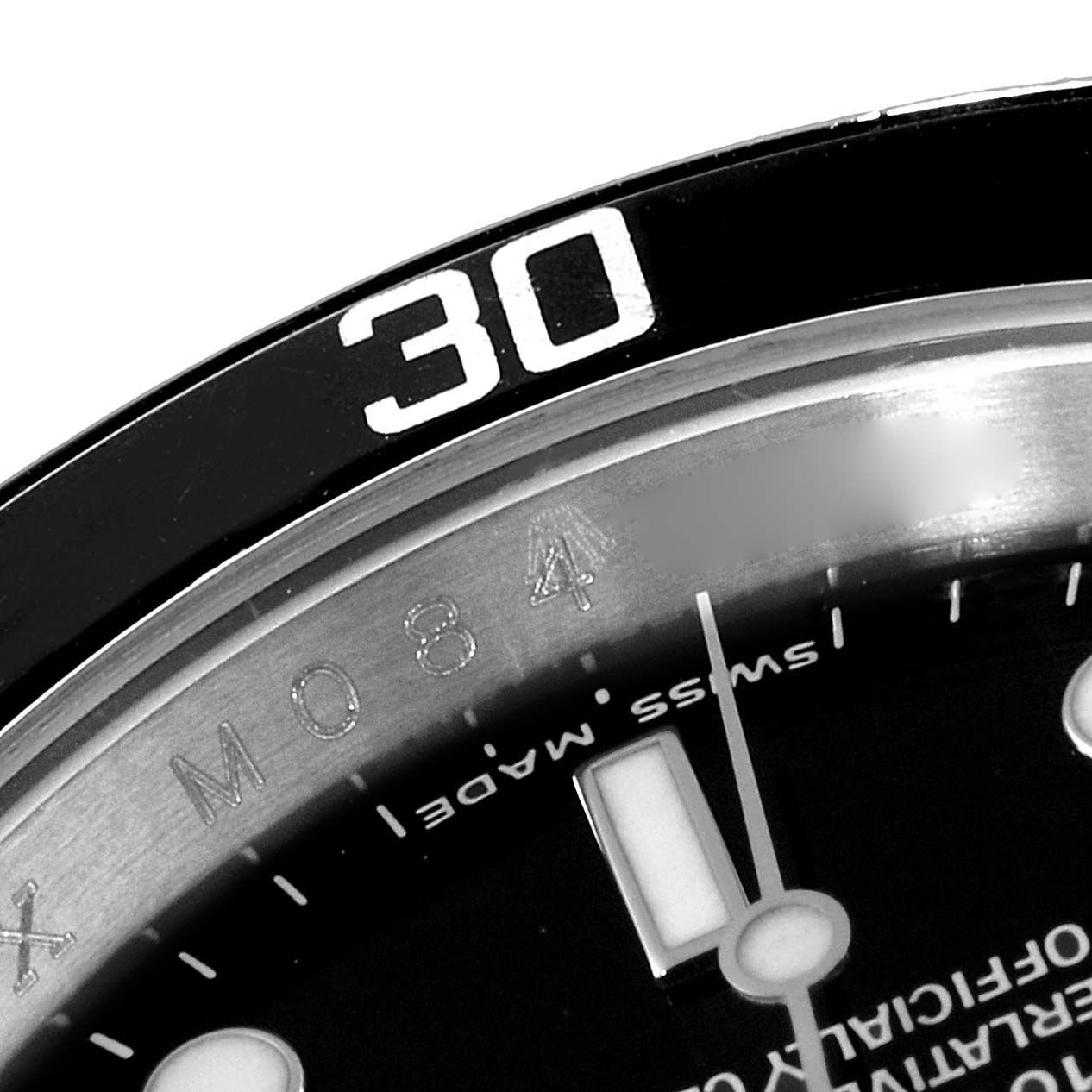 Close-up view of the bezel and part of the dial of a Rolex Submariner 16610 Men's Stainless Steel Black Dial 16610 Men's Stainless Steel Black Dial watch, showing the "30" marker and "Swiss Made" text.