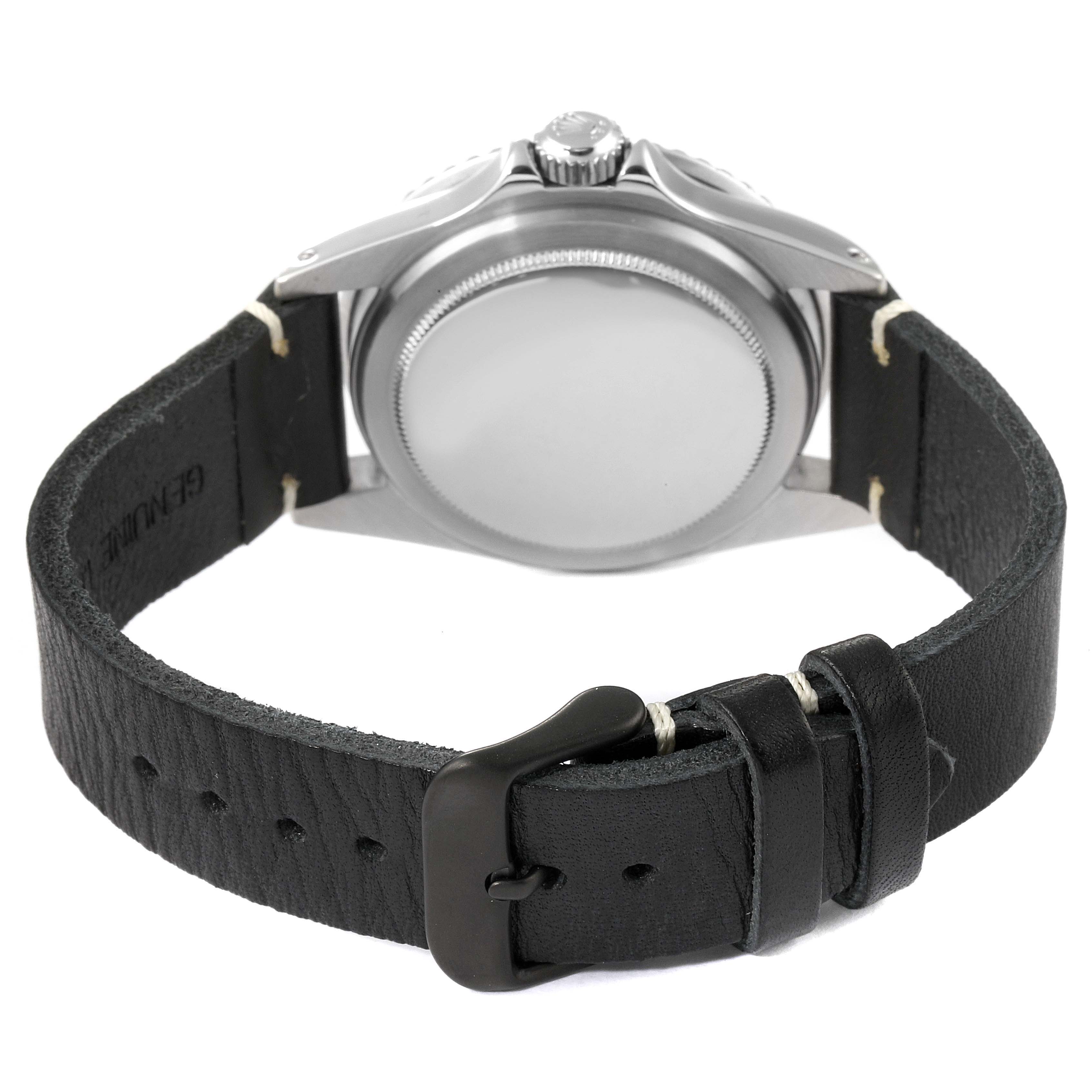 The image shows the back view of a Vintage Collection Rolex watch, focusing on the case back and black leather strap with a buckle.