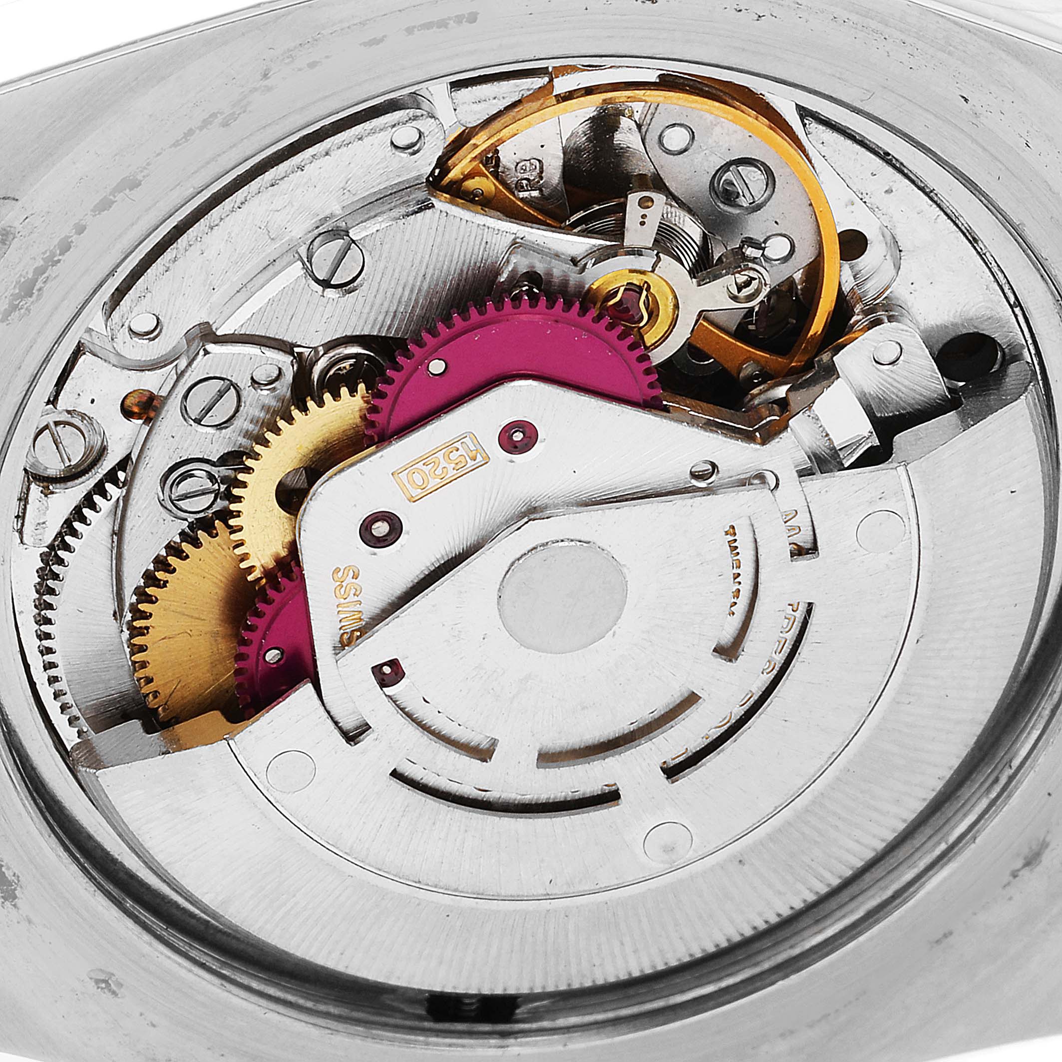 This image shows a close-up of the inner mechanical movement of a Vintage Collection Rolex watch.