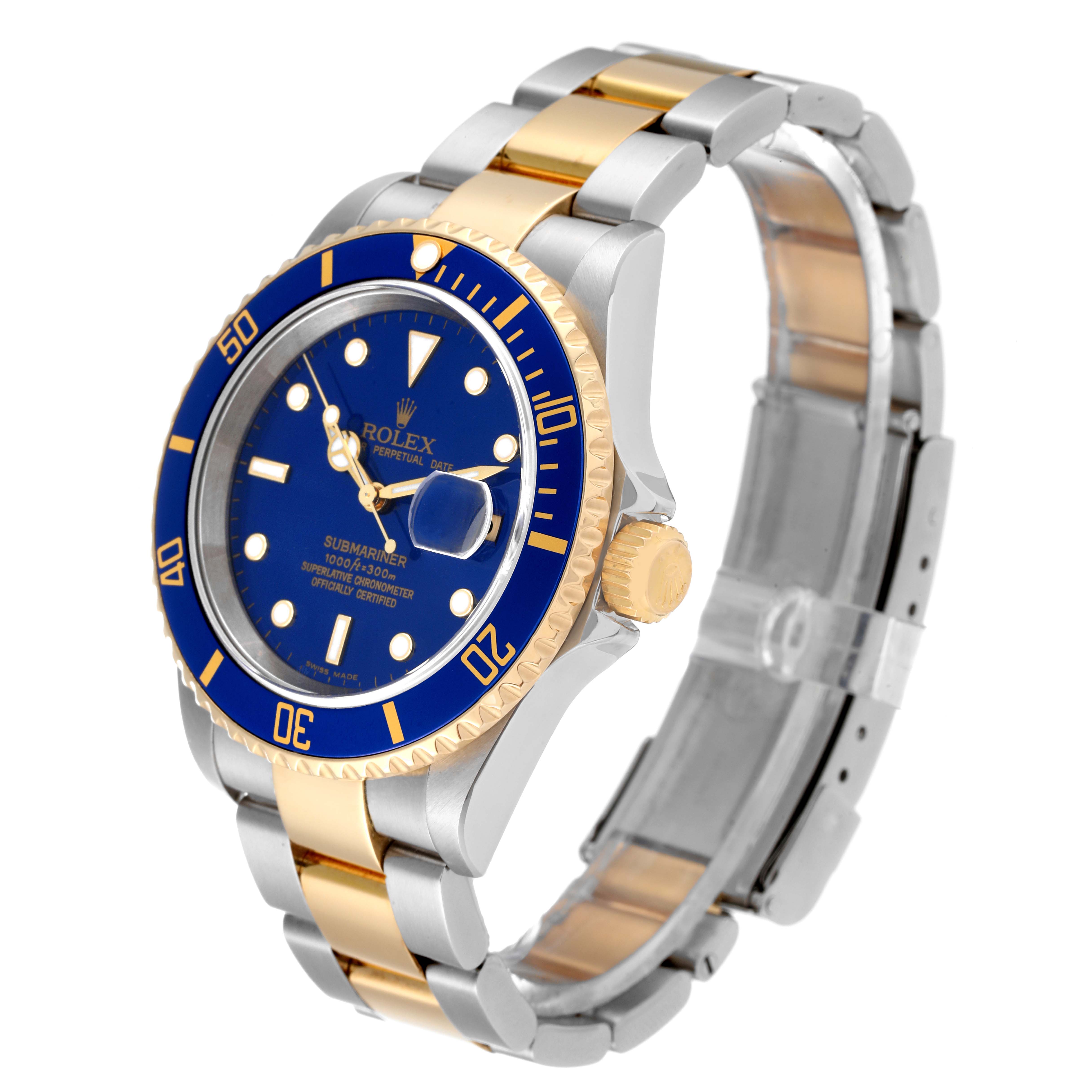 The image shows a Rolex Submariner 16613 Men
s Stainless Steel Blue Dial 16613 Men
s Stainless Steel Blue Dial watch angled to display its face, bezel, crown, and two-tone bracelet.