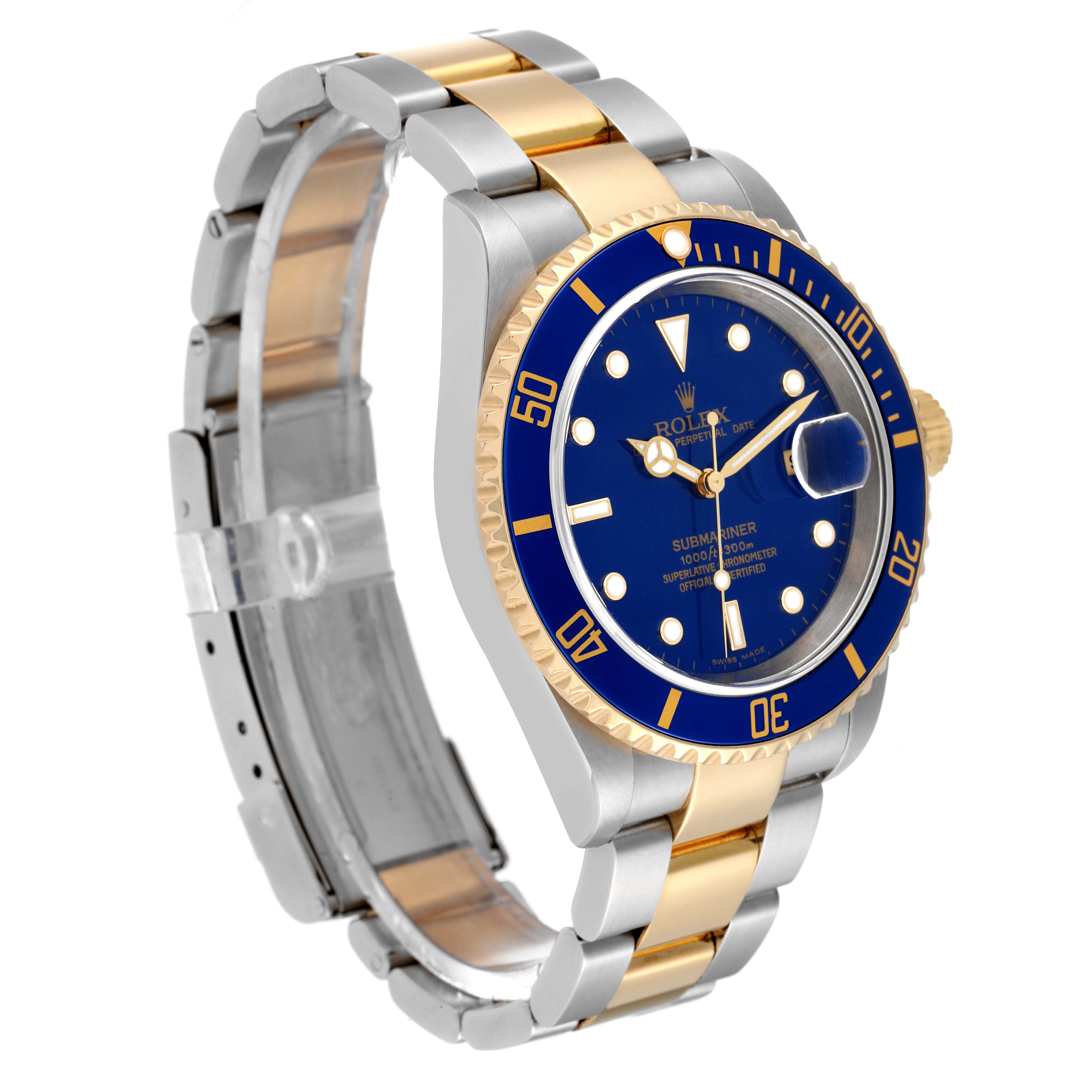 The image shows a side-angle view of a Rolex Submariner 16613 Men
s Stainless Steel Blue Dial 16613 Men
s Stainless Steel Blue Dial, highlighting its blue dial, gold and silver bracelet, and rotating bezel.