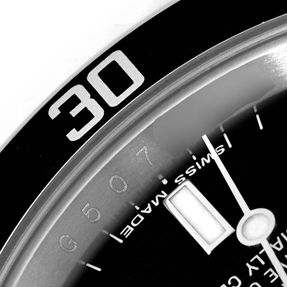 This image shows a close-up of the bezel and part of the dial of a Rolex Submariner 14060M Men
s Stainless Steel Black Dial 14060M Men
s Stainless Steel Black Dial watch, highlighting the "30" minute marker.