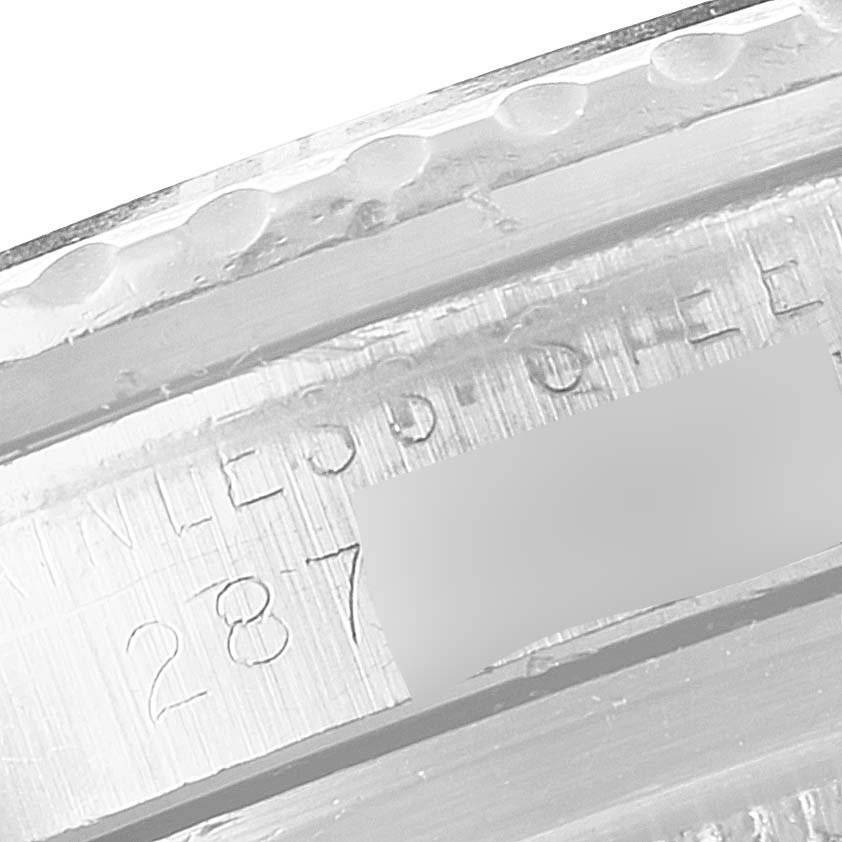 This is a close-up view of the bezel and case engraving on a Rolex Vintage Collection 1680 Men's Stainless Steel Black Dial 1680 Men's Stainless Steel Black Dial model watch.