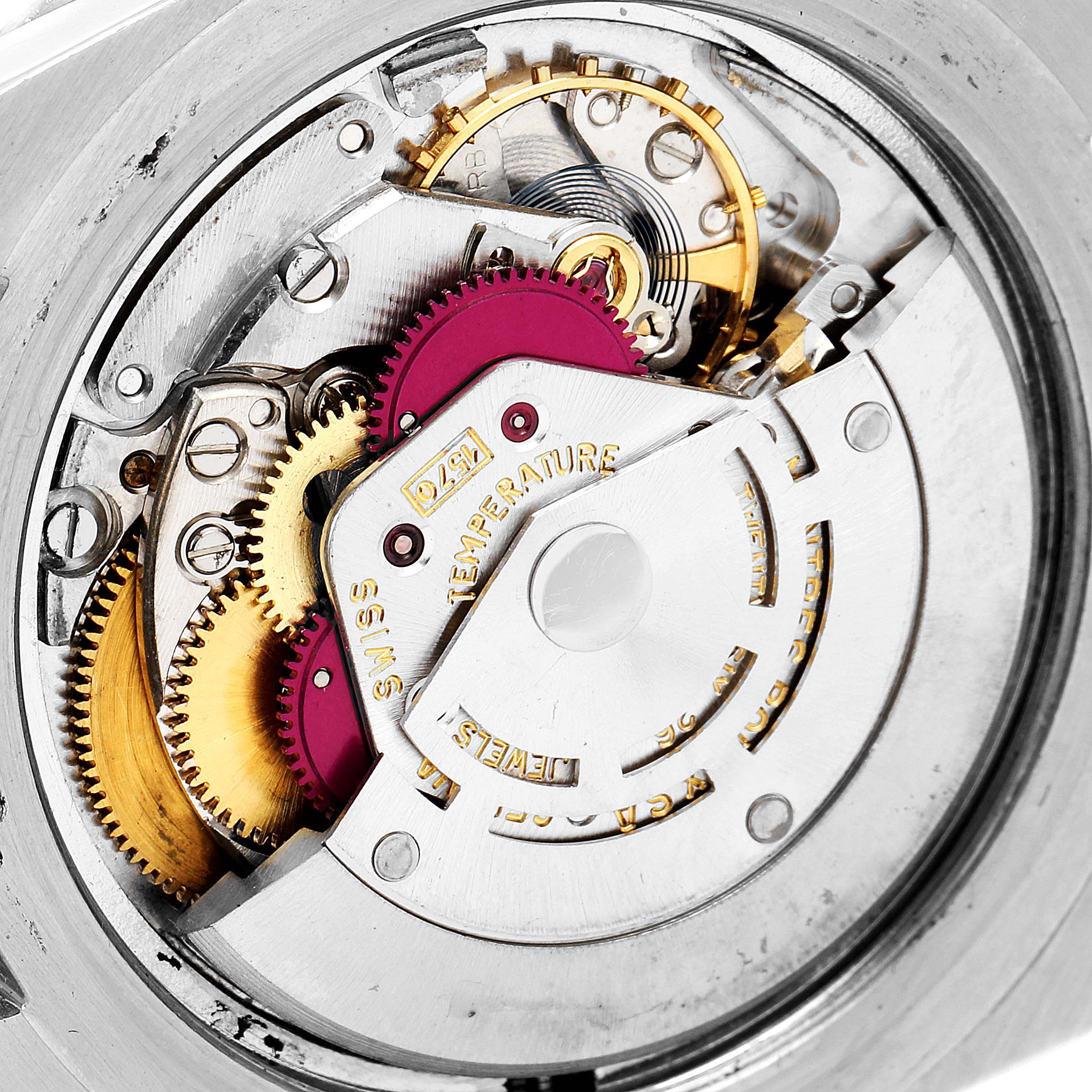 The image shows an internal mechanism of a Rolex Vintage Collection 1680 Men's Stainless Steel Black Dial 1680 Men's Stainless Steel Black Dial watch at a close-up angle, highlighting gears and intricate parts.