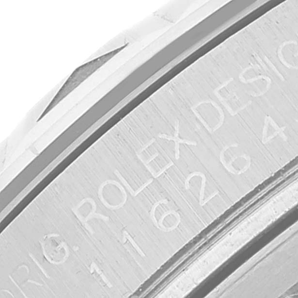 This is a close-up of the casing side of a Rolex Turn-o-Graph 116264 Men's Stainless Steel White Dial 116264 Men's Stainless Steel White Dial watch, showing "ROLEX DESIGN" engraving.