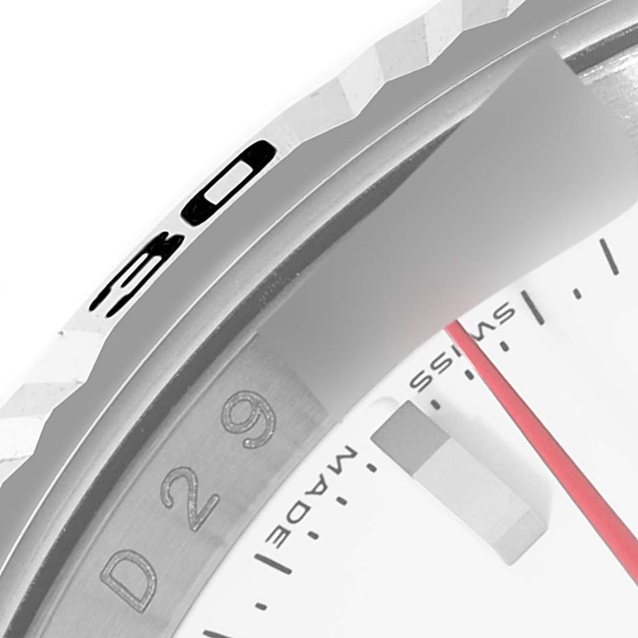 The image shows a close-up of the bezel and part of the dial of a Rolex Turn-o-Graph 116264 Men's Stainless Steel White Dial 116264 Men's Stainless Steel White Dial watch.