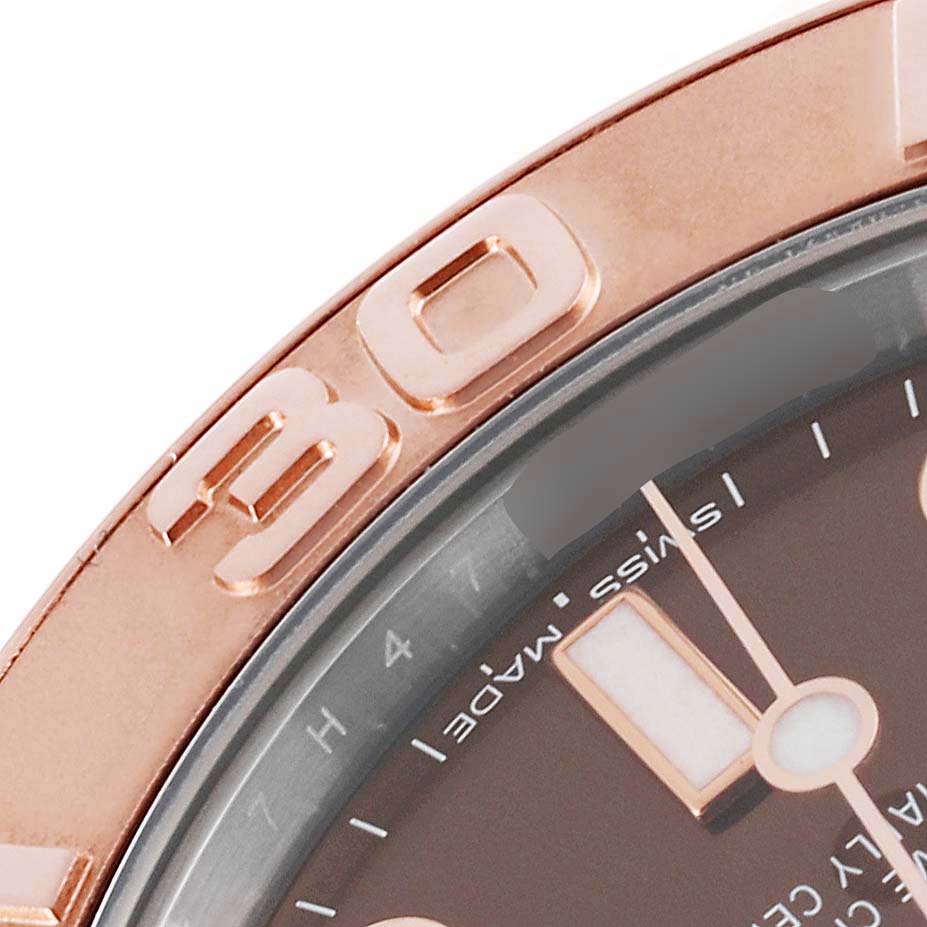 The image shows a close-up of the bezel and part of the dial of a Rolex Yacht-Master 268621 Men's Steel and Gold (two tone) Brown Dial 268621 Men's Steel and Gold (two tone) Brown Dial watch.