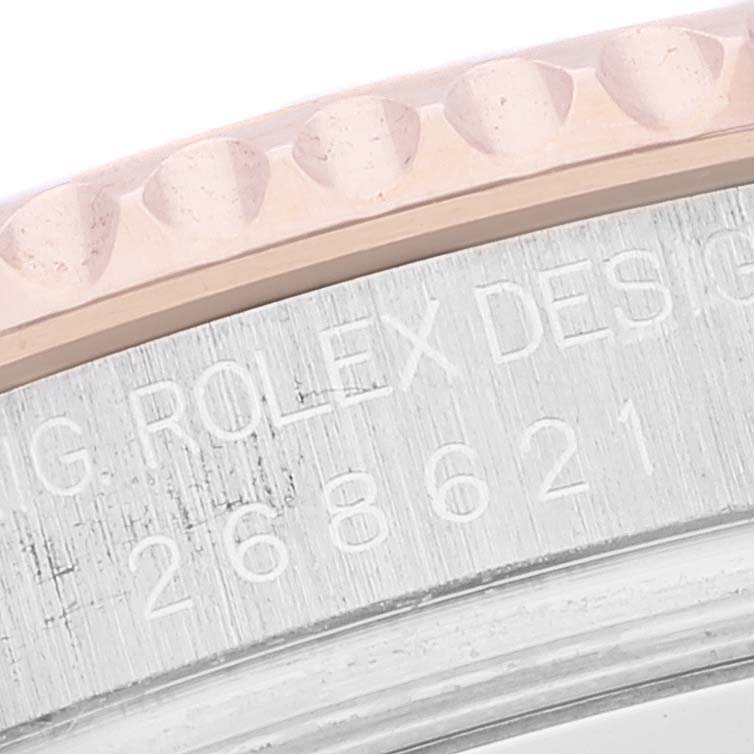 This image shows a close-up of the engraved bezel and serial number of the Rolex Yacht-Master 268621 Men's Steel and Gold (two tone) Brown Dial 268621 Men's Steel and Gold (two tone) Brown Dial watch.