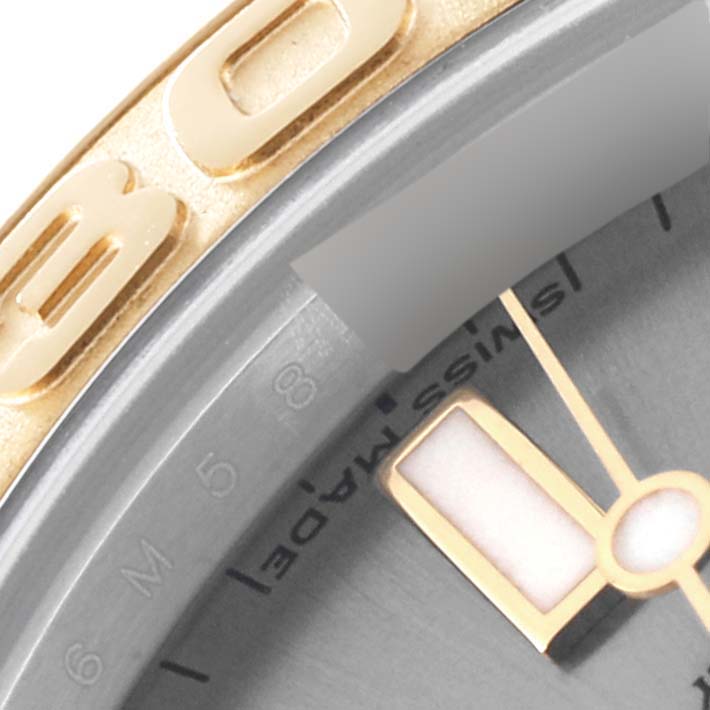Close-up of the Rolex Yacht-Master 168623 Men's Steel and Gold (two tone) Grey Dial 168623 Men's Steel and Gold (two tone) Grey Dial watch showing part of the bezel, dial, and "Swiss Made" inscription.
