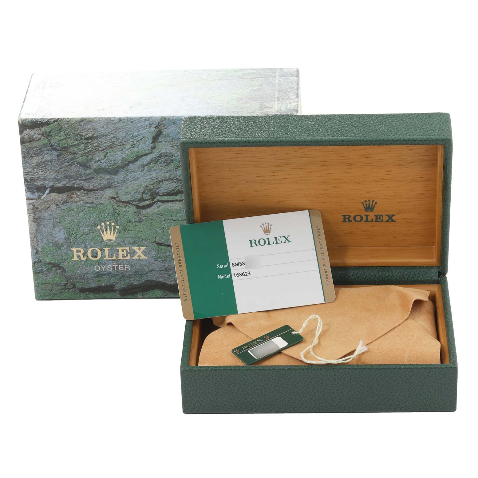The image shows the box, warranty card, and tag of a Rolex Yacht-Master 168623 Men's Steel and Gold (two tone) Grey Dial 168623 Men's Steel and Gold (two tone) Grey Dial watch, along with the watch covered with a cloth.