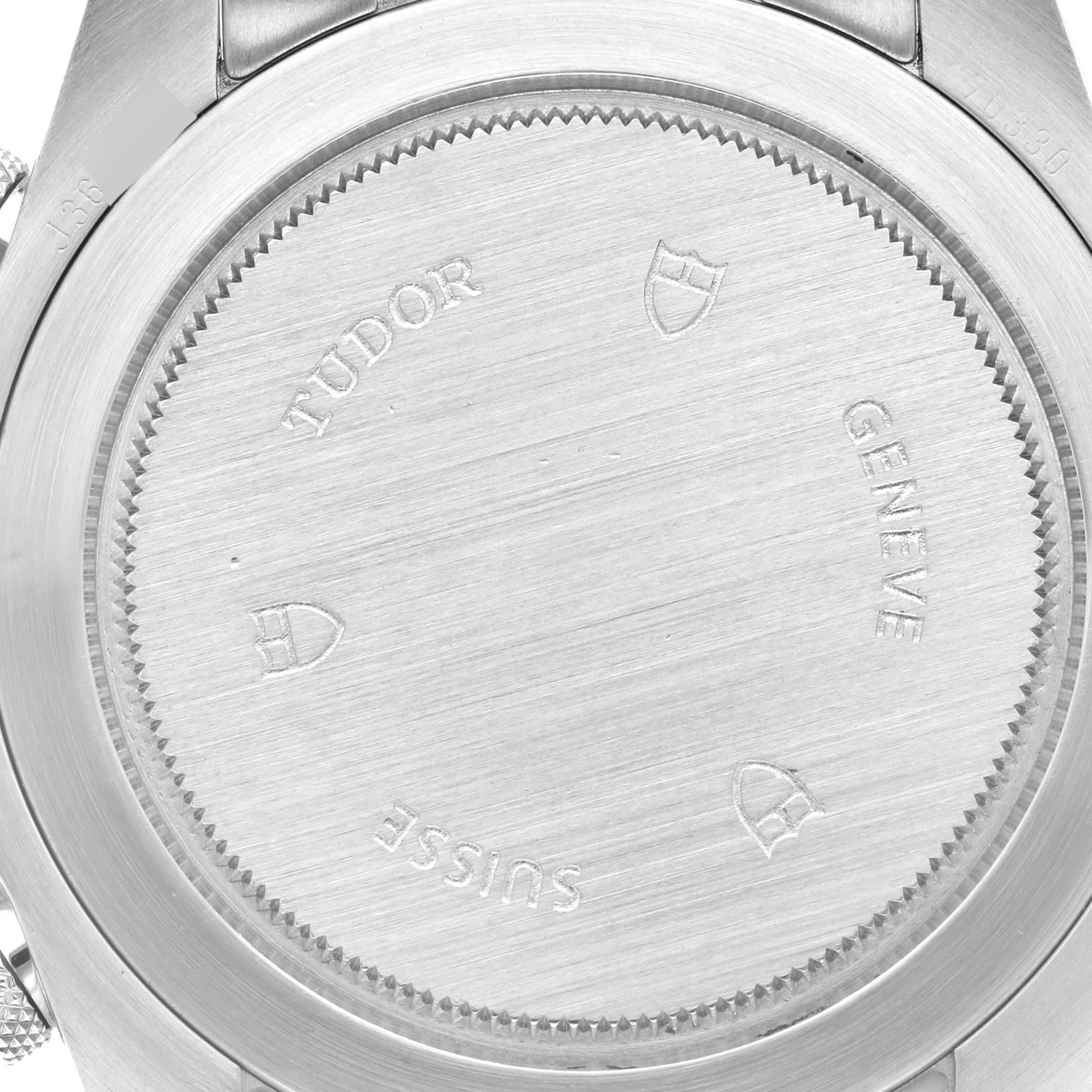 This is a close-up of the case back of a Tudor Heritage Chrono 70330N-95740 Men
s Stainless Steel Black Dial 70330N-95740 Men
s Stainless Steel Black Dial watch, showing the engravings and brushed metal finish.