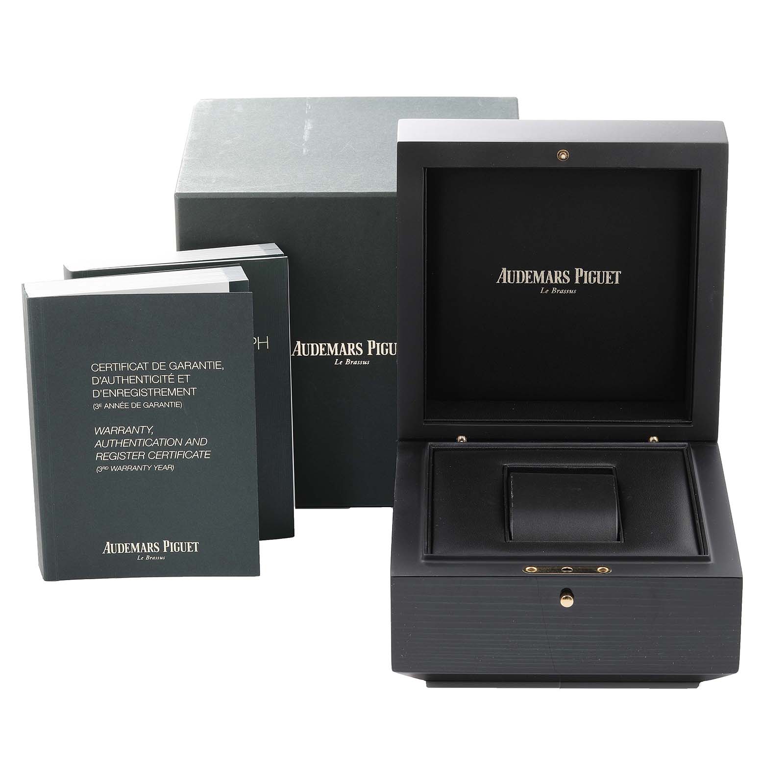 The image shows the packaging and accessories for an Audemars Piguet Royal Oak 26320ST.00.1220ST.01 Men's Stainless Steel Black Dial 26320ST.00.1220ST.01 Men's Stainless Steel Black Dial, including the box, warranty card, and booklet.