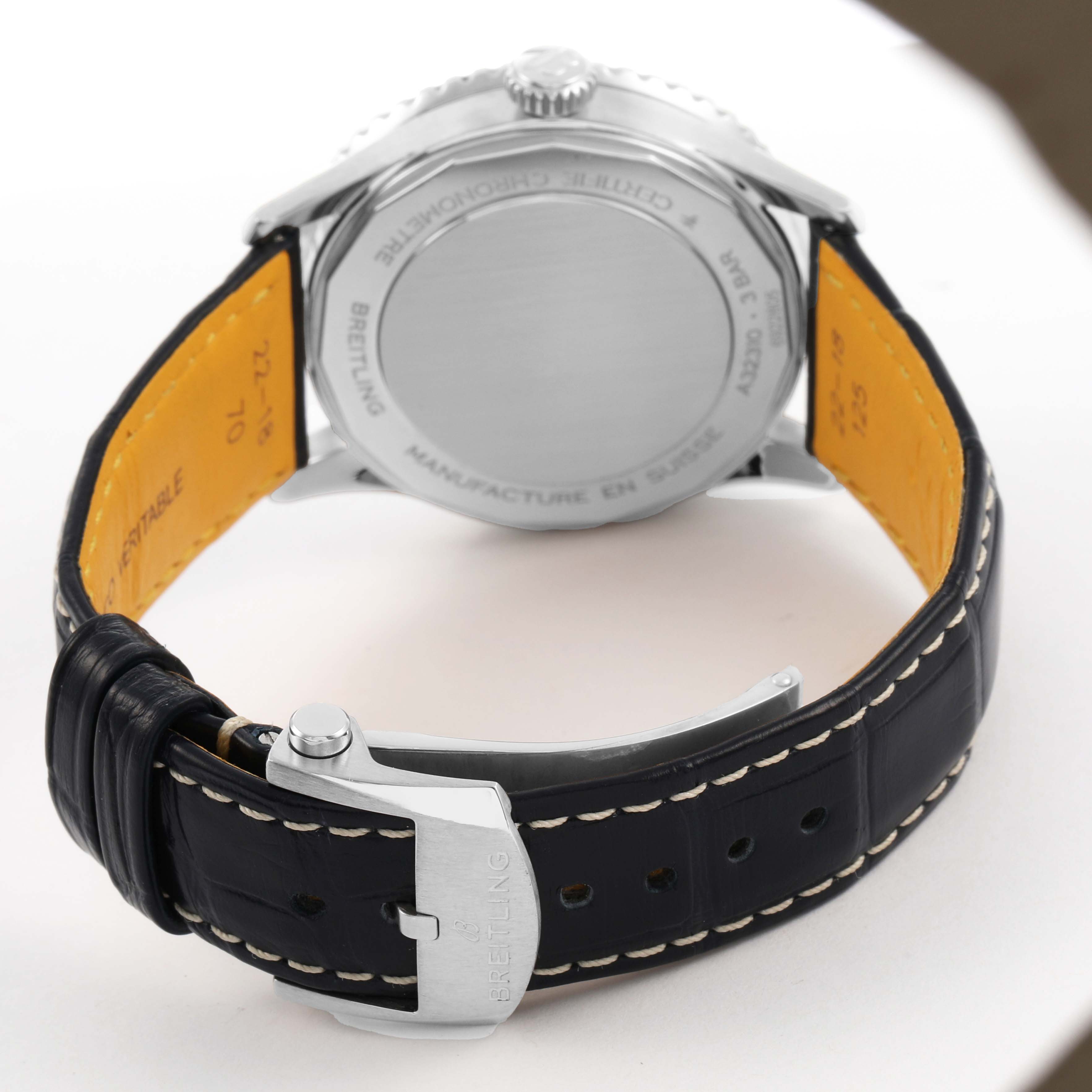 The image shows the back of a Breitling Navitimer A32310 Men's Stainless Steel Blue Dial, highlighting the case back, lugs, and leather strap with buckle.