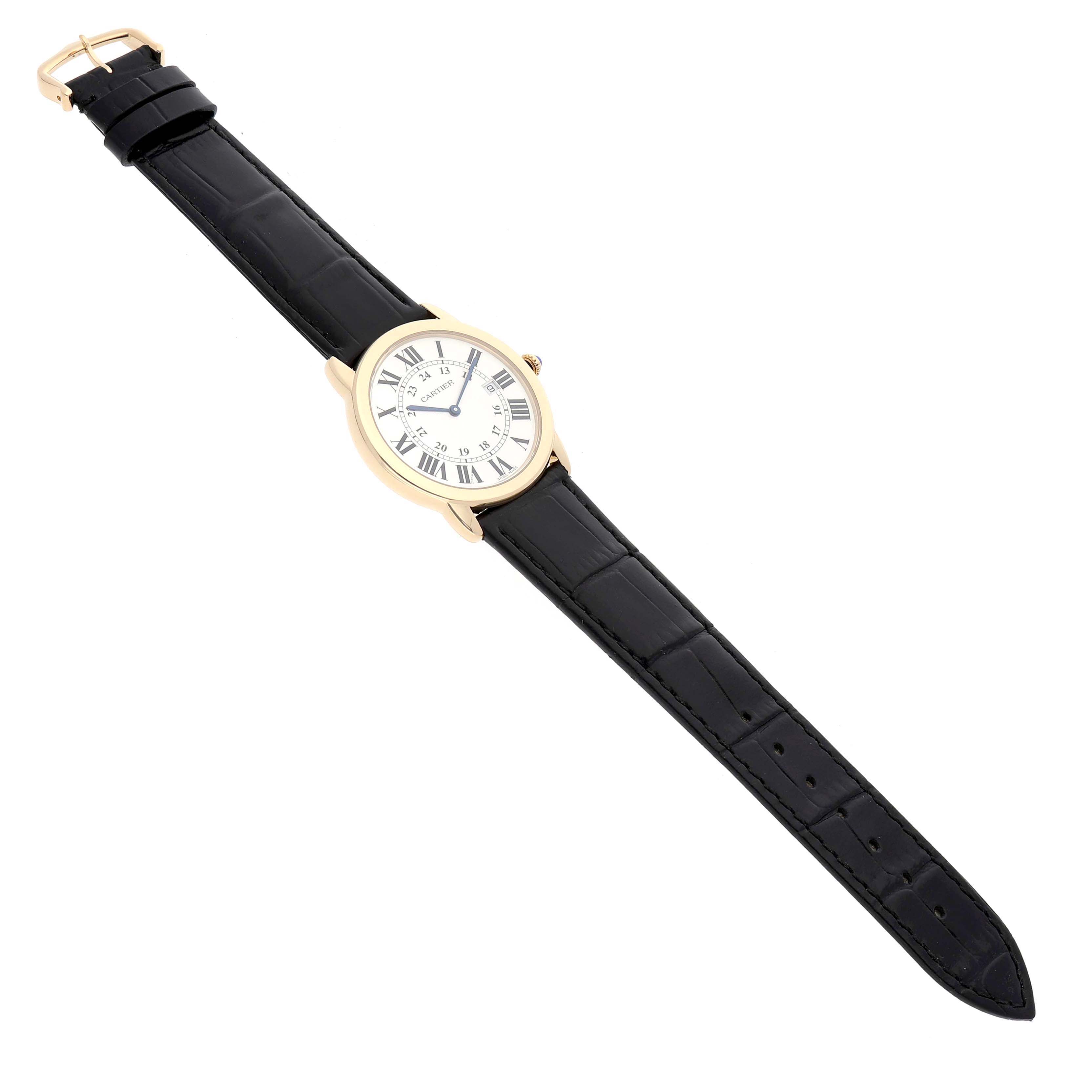 The Cartier Ronde W6700455 Men's Yellow Gold Silver Dial watch is shown from a top-down angle, displaying its face, gold case, and black leather strap.