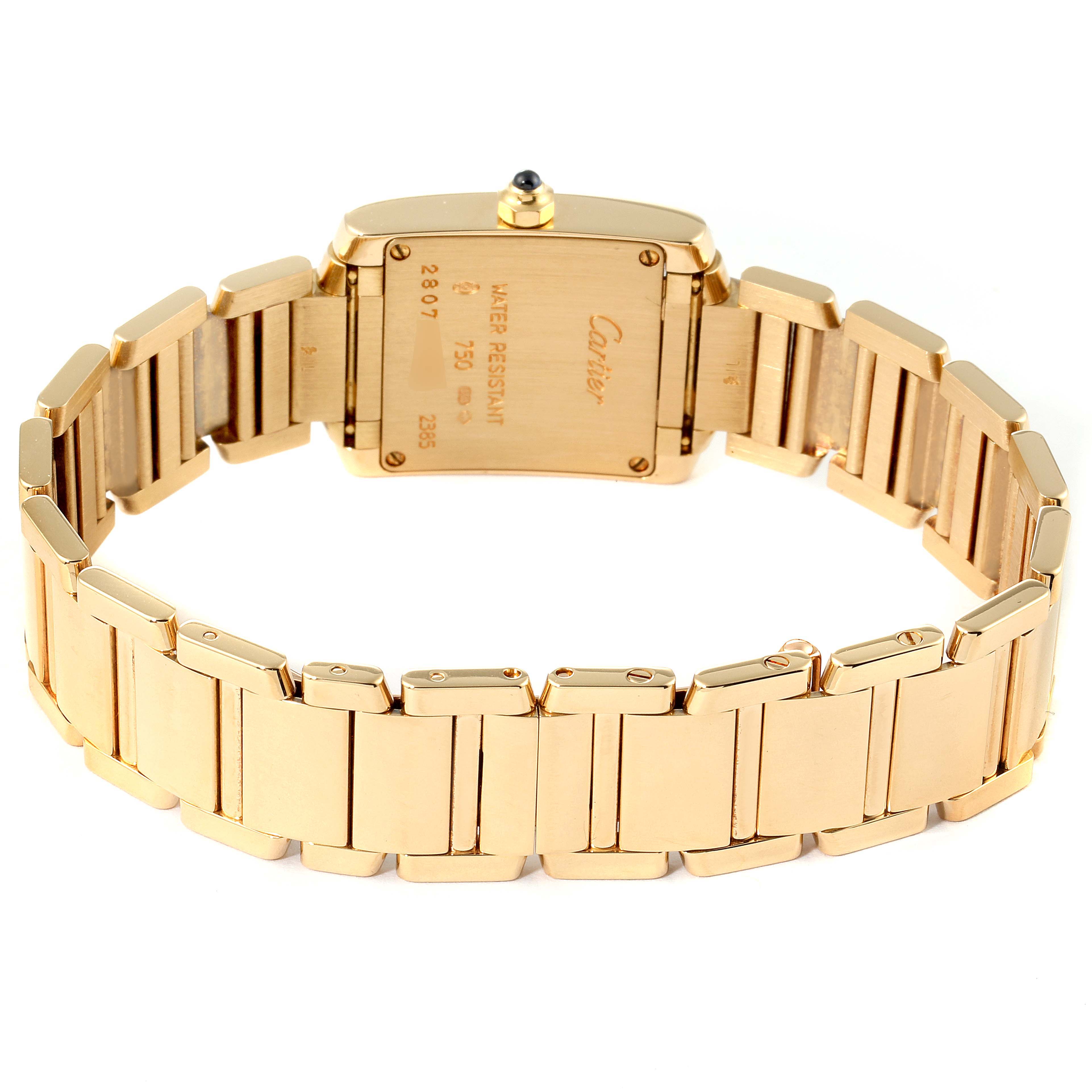 The image shows the back view of the Cartier Tank Française watch, highlighting the case back and gold bracelet.