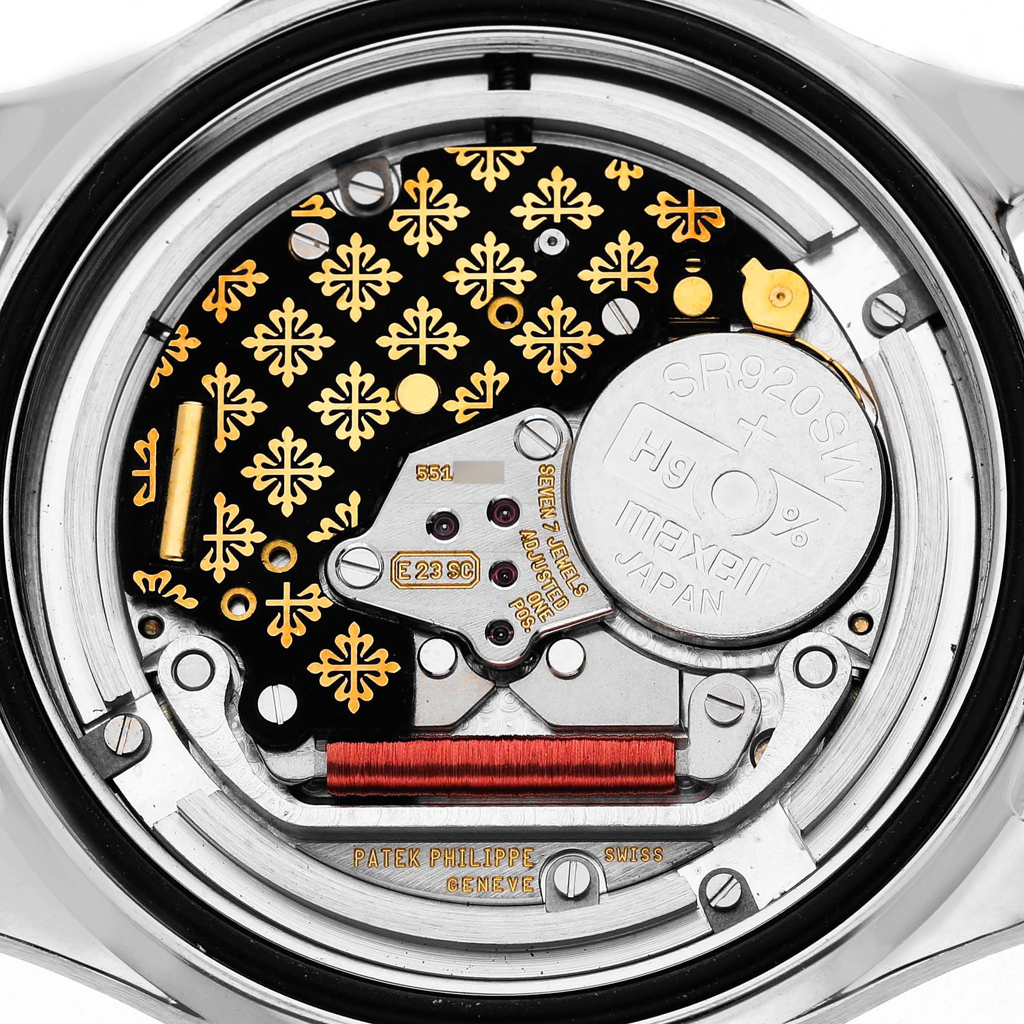 The image shows the intricate movement and battery of a Patek Philippe Aquanaut 5087/1A-001 Women's Stainless Steel Black Dial watch from a rear angle.