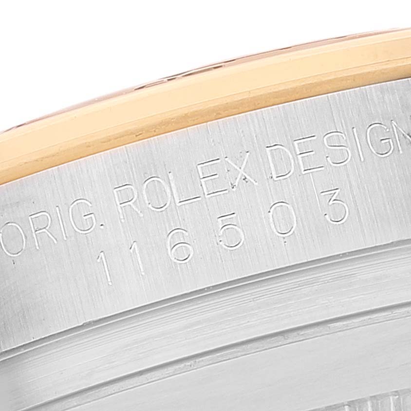 This image shows a close-up view of the engraved side of the casing on a Rolex Daytona 116503 Men's Steel and Gold (two tone) Black Dial 116503 Men's Steel and Gold (two tone) Black Dial watch.