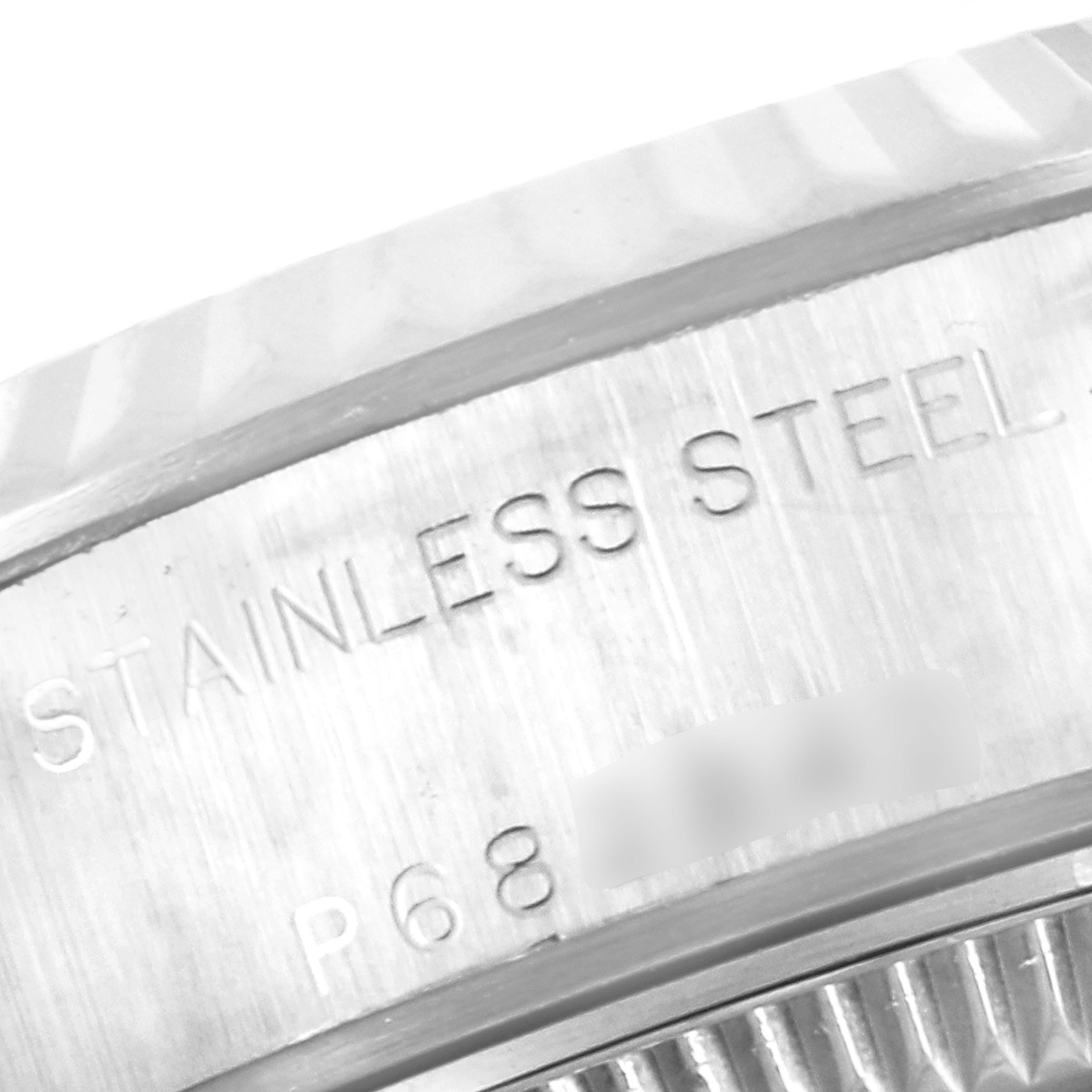This close-up image shows the stainless steel bezel and engraved text on the side of a Rolex Datejust 79174 Women's Stainless Steel Silver Dial 79174 Women's Stainless Steel Silver Dial watch.