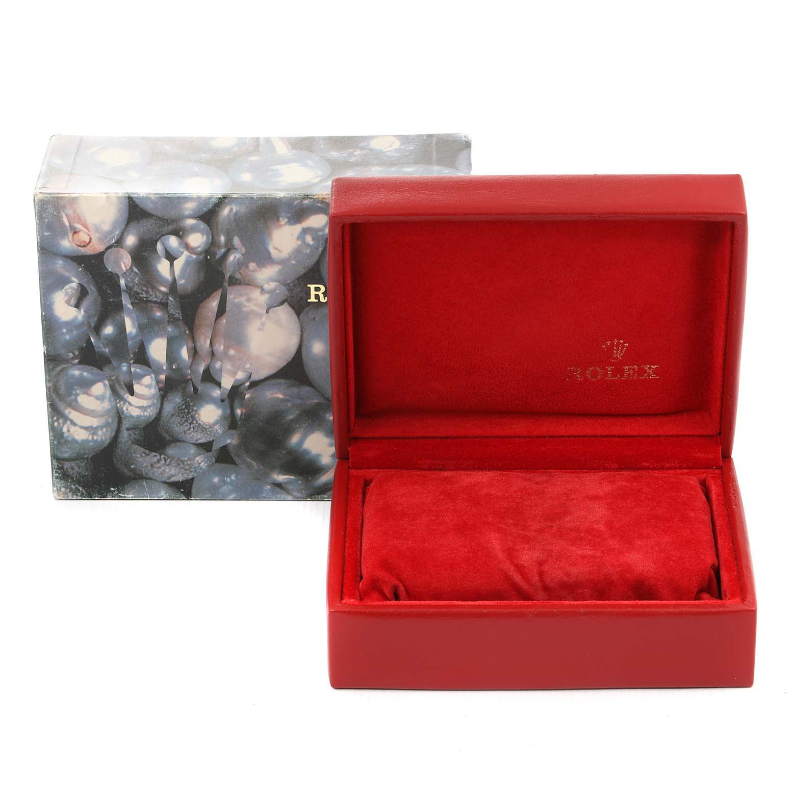 The image shows an open red Rolex box designed to hold a Datejust model watch, along with its decorative outer packaging.