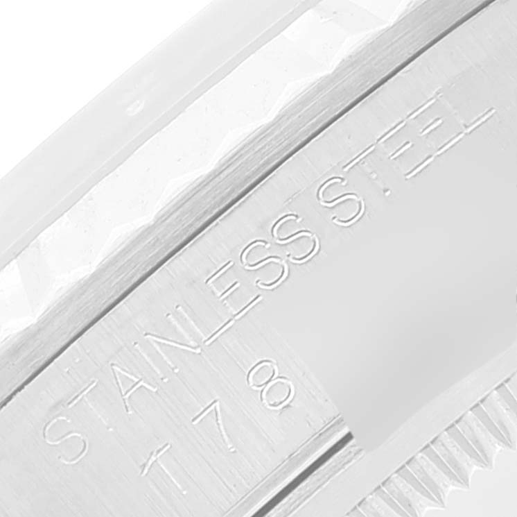 This image shows a close-up of the stainless steel engraving on the bezel of a Rolex Datejust 16234 Men's Stainless Steel White Dial 16234 Men's Stainless Steel White Dial watch.