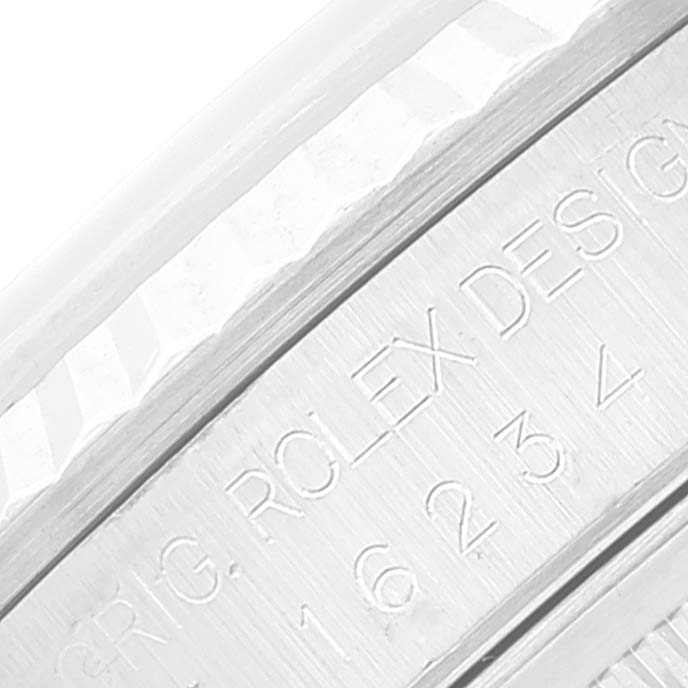 This is an up-close shot of the inner engraving on the bezel of a Rolex Datejust 16234 Men's Stainless Steel White Dial 16234 Men's Stainless Steel White Dial watch.