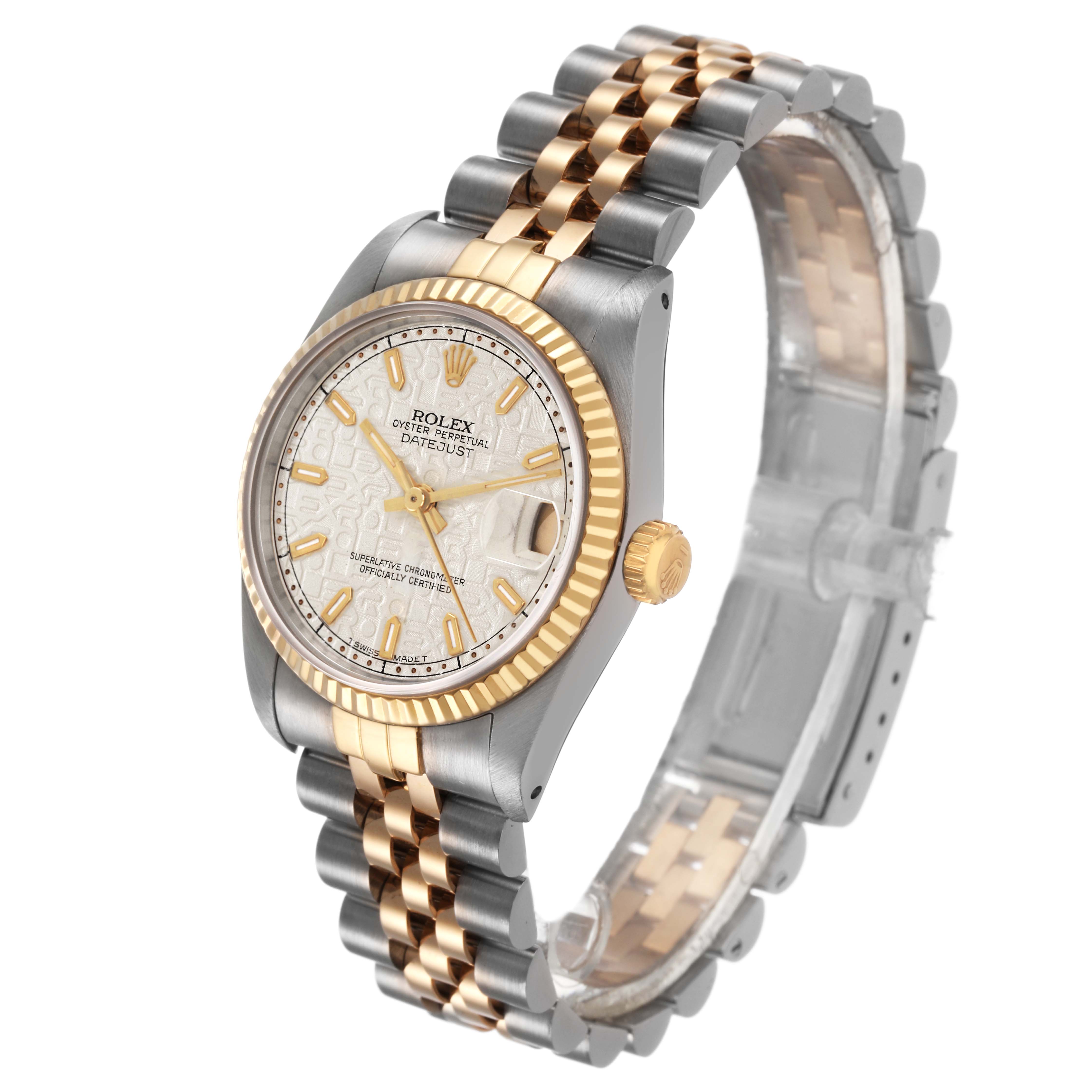 The Rolex Mid-Size 68273 Women's Steel and Gold (two tone) White Dial watch is shown at a three-quarter angle, highlighting its two-tone bracelet, fluted bezel, and dial.