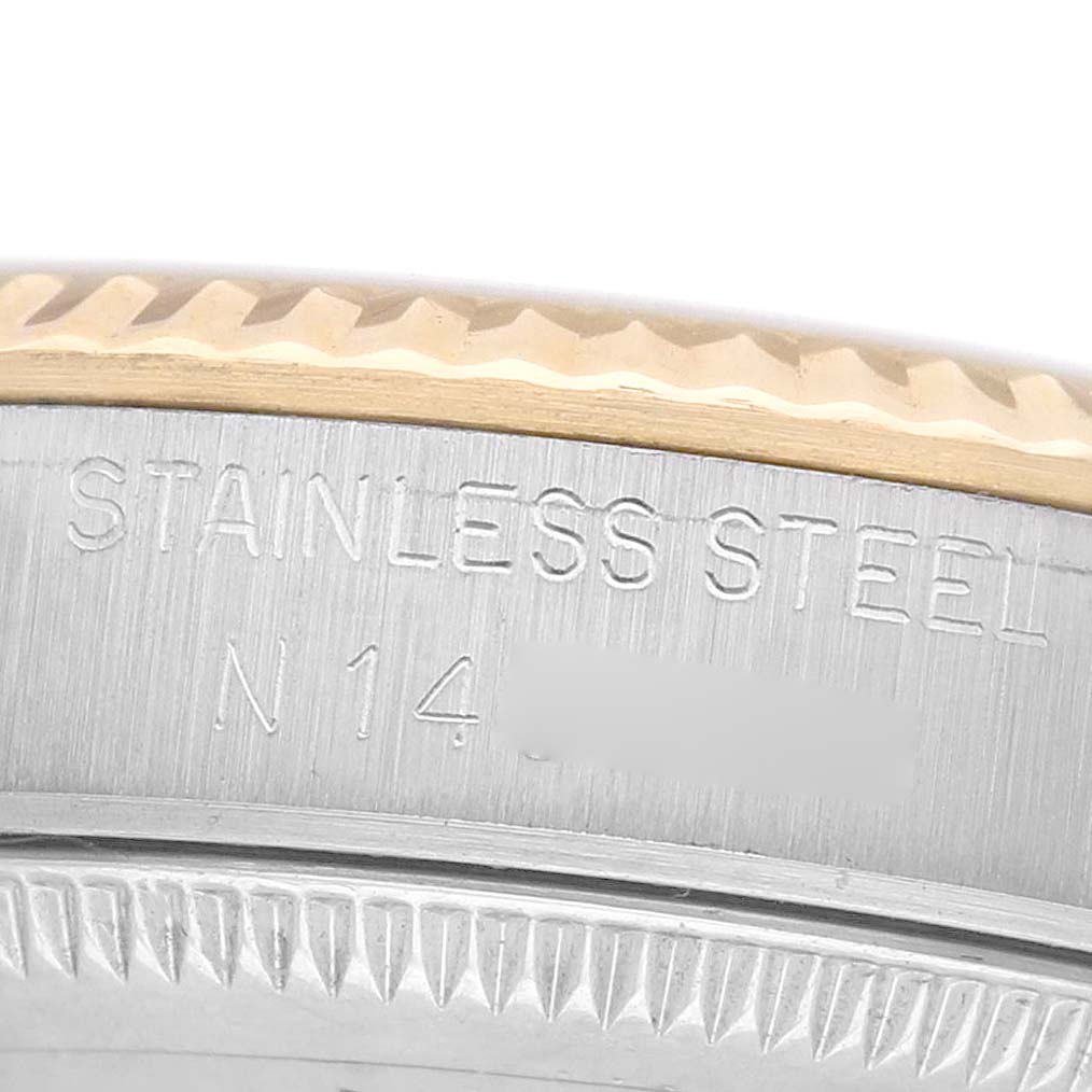 The image shows a close-up of the stainless steel side and bezel of a Rolex Mid-Size 68273 Women's Steel and Gold (two tone) White Dial watch.