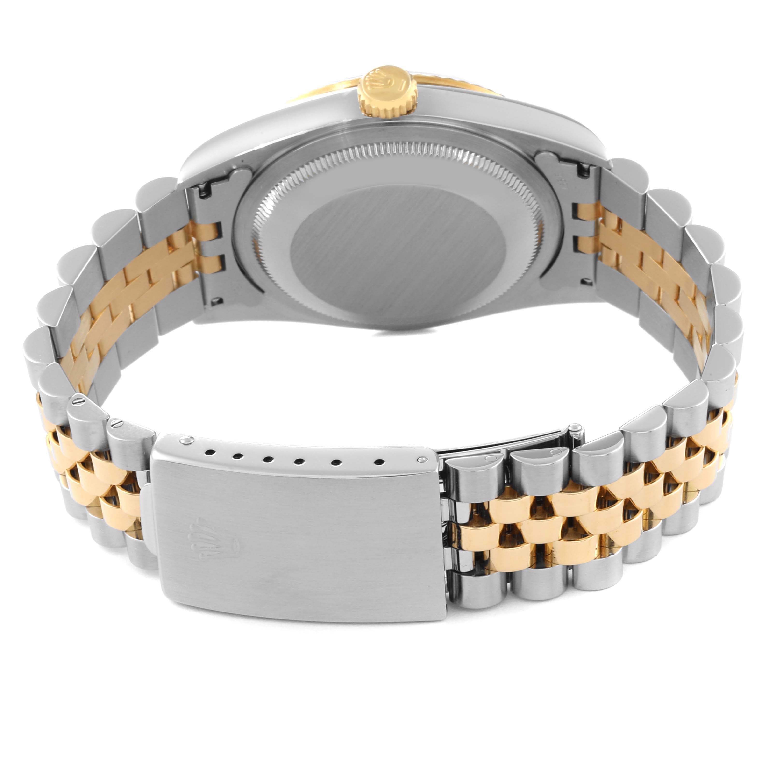 This image shows the back view of a Rolex Datejust 16233 Men's Steel and Gold (two tone) Beige Dial 16233 Men's Steel and Gold (two tone) Beige Dial watch with a two-tone bracelet and closed clasp.