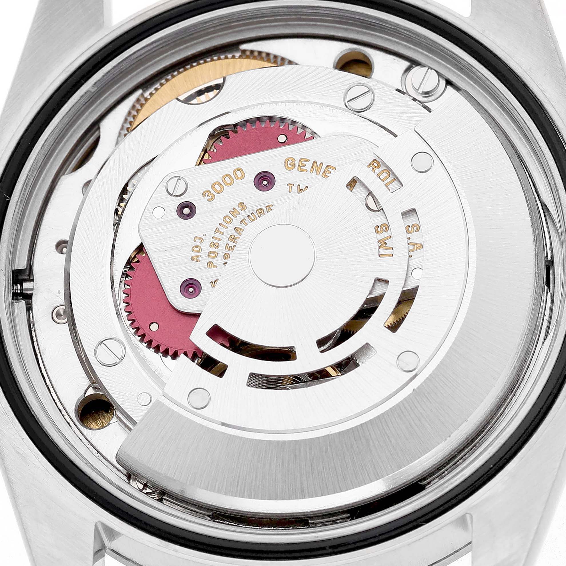 The image shows the movement mechanism of a Rolex Explorer 14270 Men's Stainless Steel Black Dial watch, viewed from the back with visible gears and rotor.