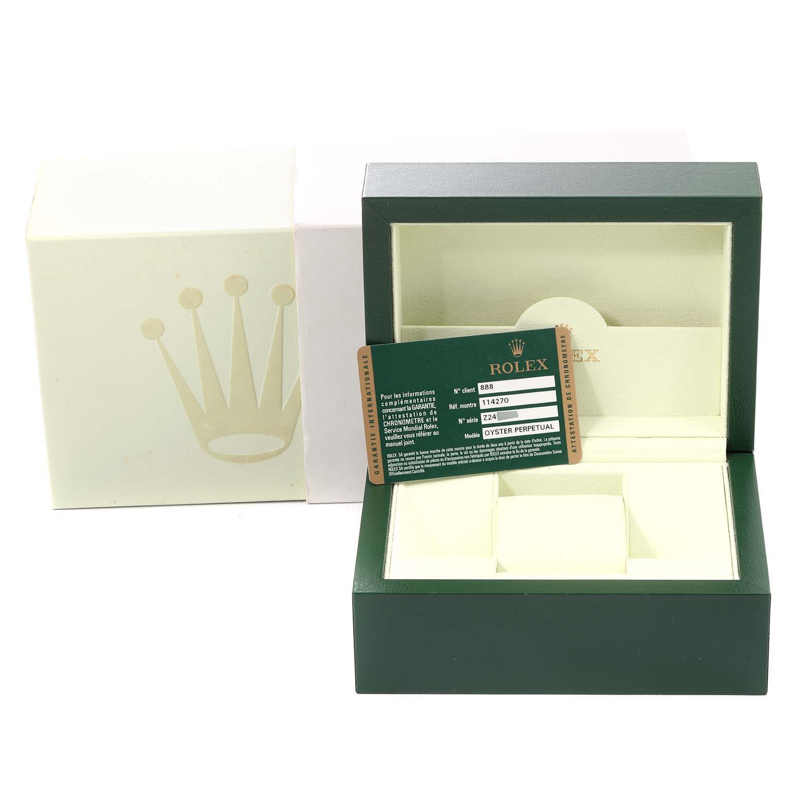 This image shows the packaging and warranty card for a Rolex Explorer 114270 Men's Stainless Steel Black Dial 114270 Men's Stainless Steel Black Dial model.