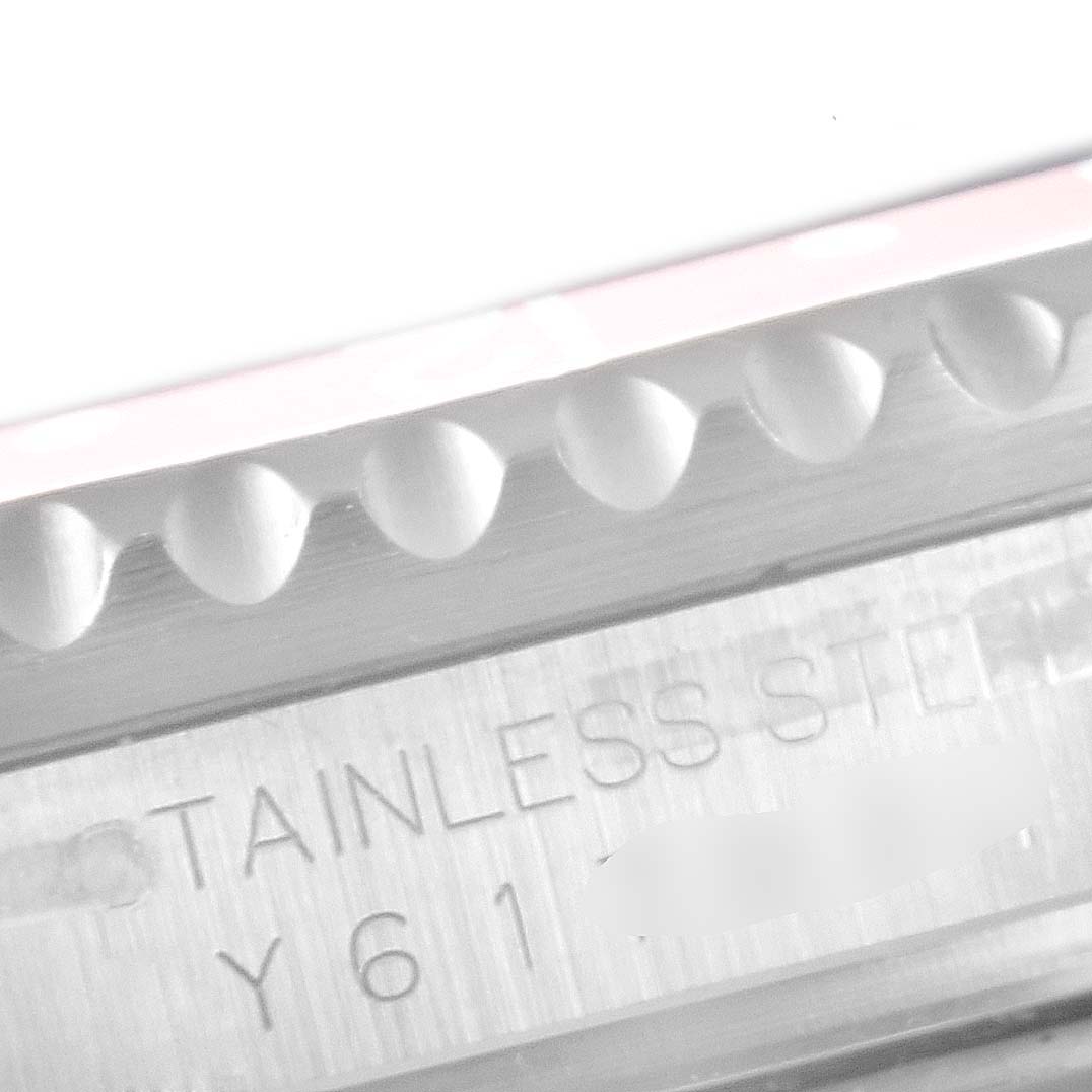 This image shows a close-up of the bezel and steel case back of a Rolex GMT-Master 16710 Men
s Stainless Steel Black Dial 16710 Men
s Stainless Steel Black Dial watch, highlighting the stainless steel engraving.