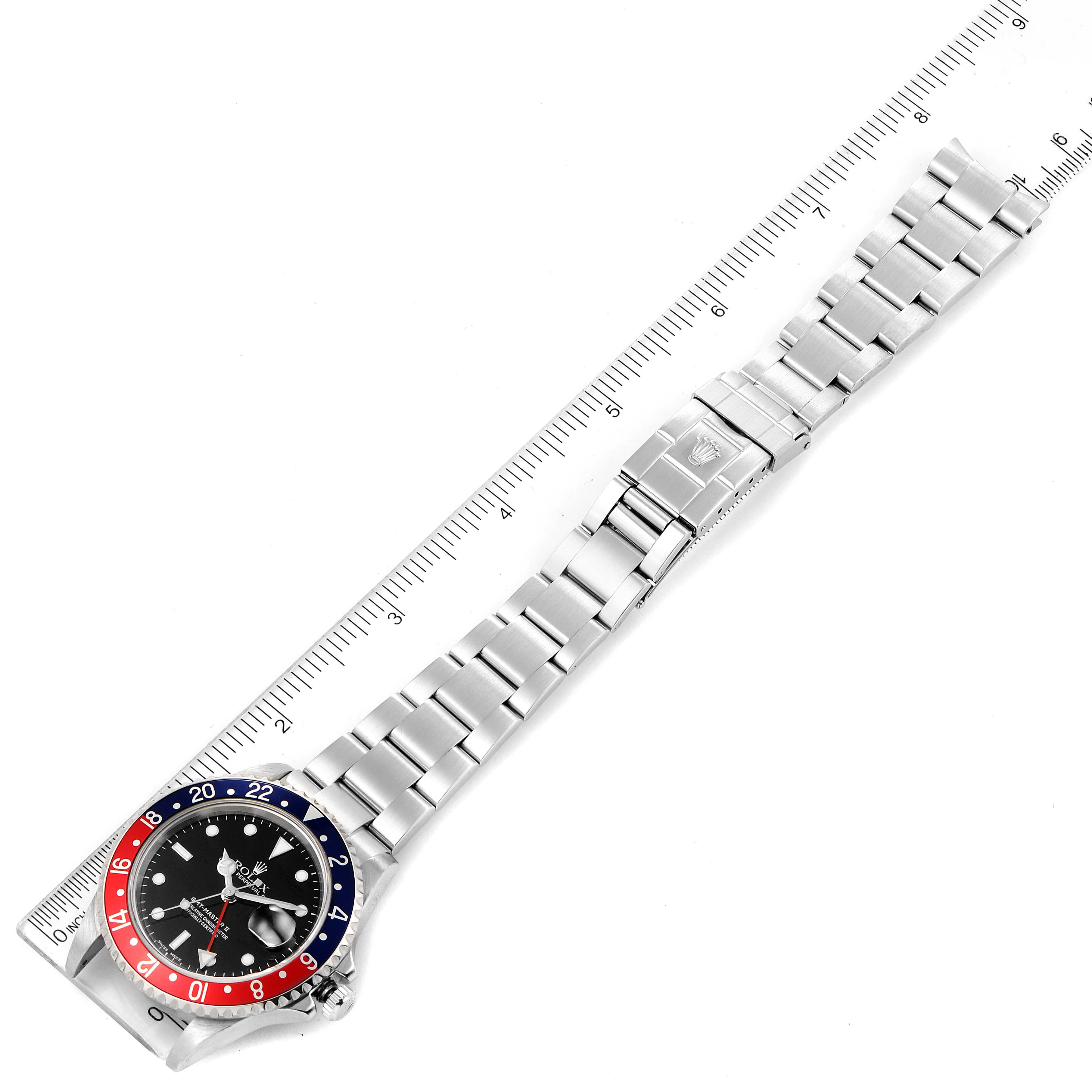 This image shows a top view of a Rolex GMT-Master 16710 Men
s Stainless Steel Black Dial 16710 Men
s Stainless Steel Black Dial watch, featuring its bezel, dial, bracelet, and clasp.