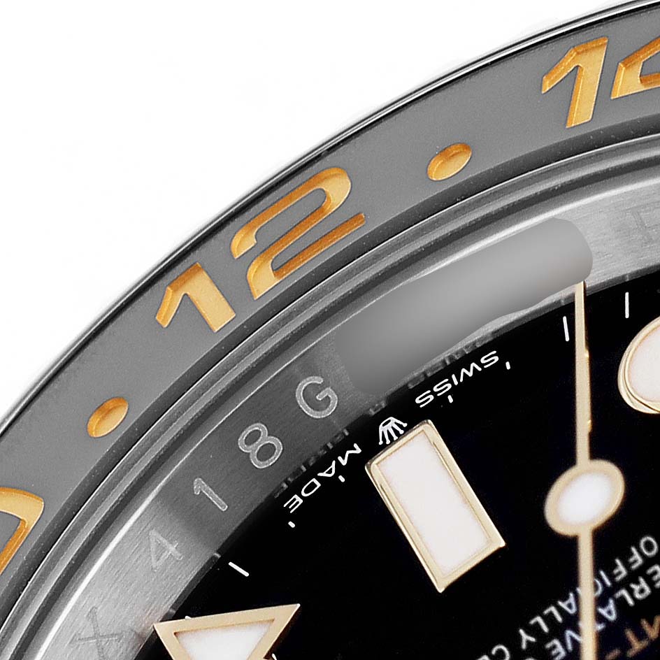 The image shows a close-up of the bezel and part of the dial of a Rolex GMT-Master 126713 Men's Stainless Steel Black Dial, highlighting the numbers and markers.