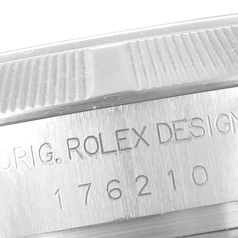The image shows a close-up of the bezel and case side of a Rolex Oyster Perpetual 176210 Women
s Stainless Steel Blue Dial 176210 Women
s Stainless Steel Blue Dial watch, displaying the engraving "ORIG. ROLEX DESIGN 176210."