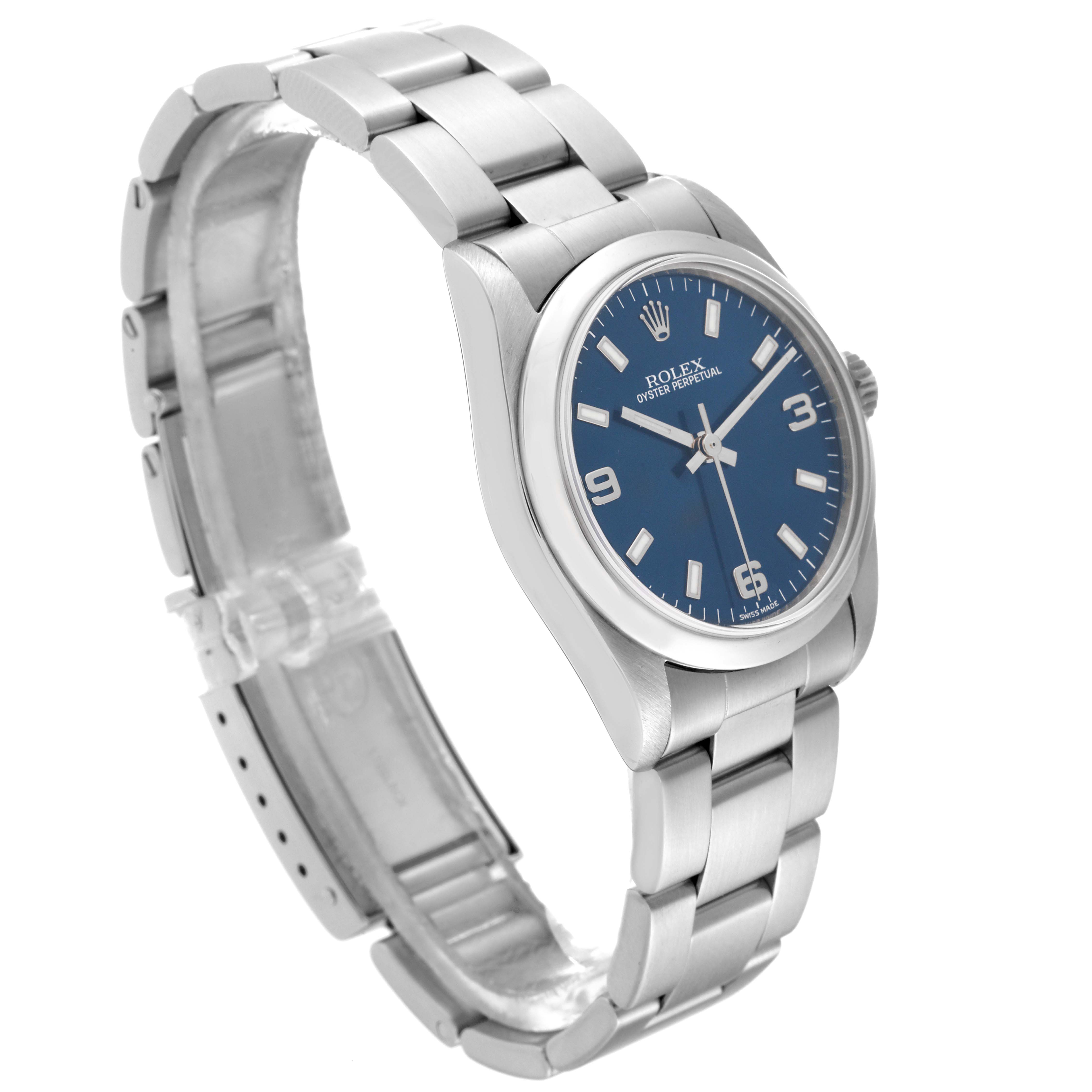 The image shows a Rolex Oyster Perpetual Mid-Size watch at a three-quarter angle, highlighting its blue dial and stainless steel bracelet.