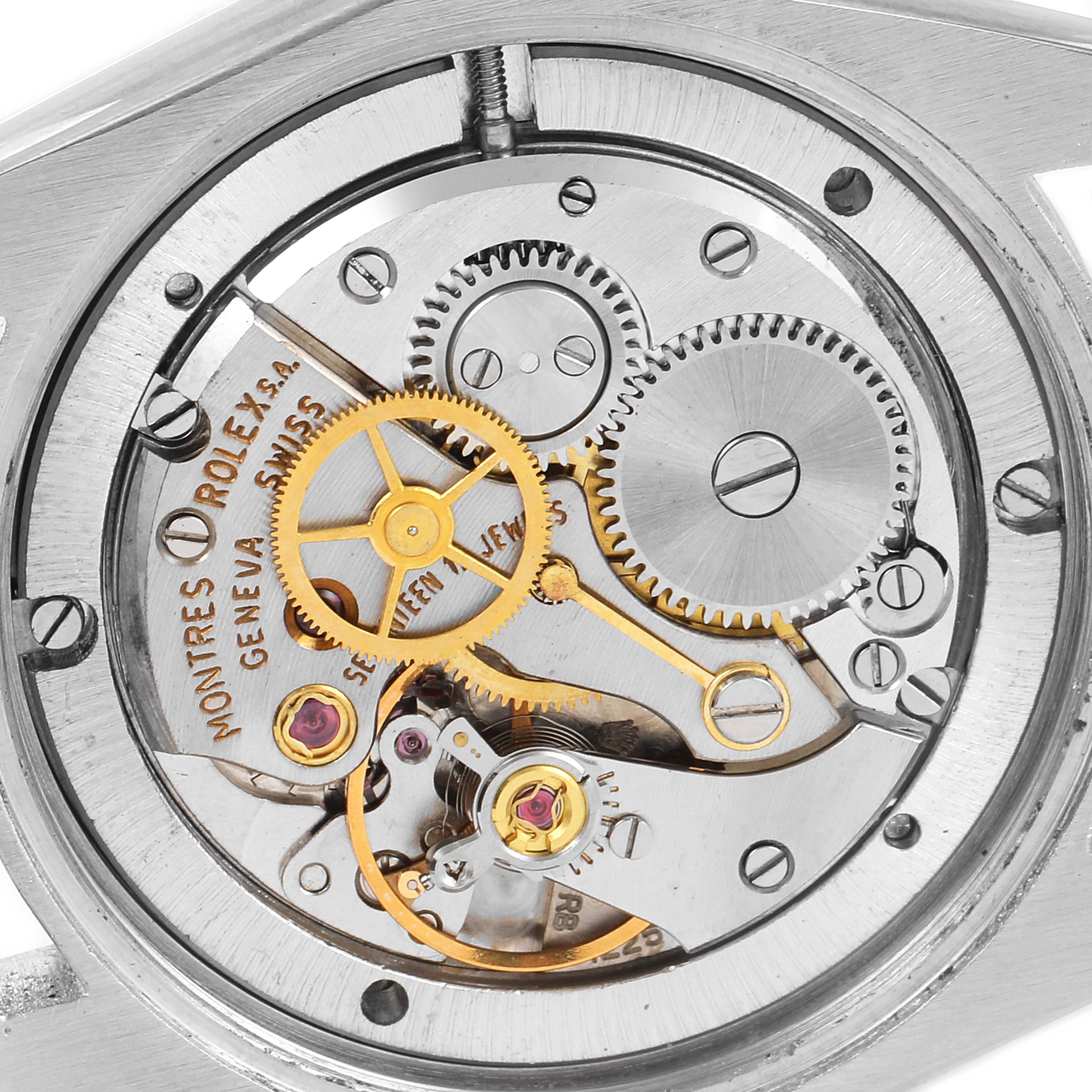 This image shows a close-up of the internal movement mechanism of a Vintage Collection Rolex watch.