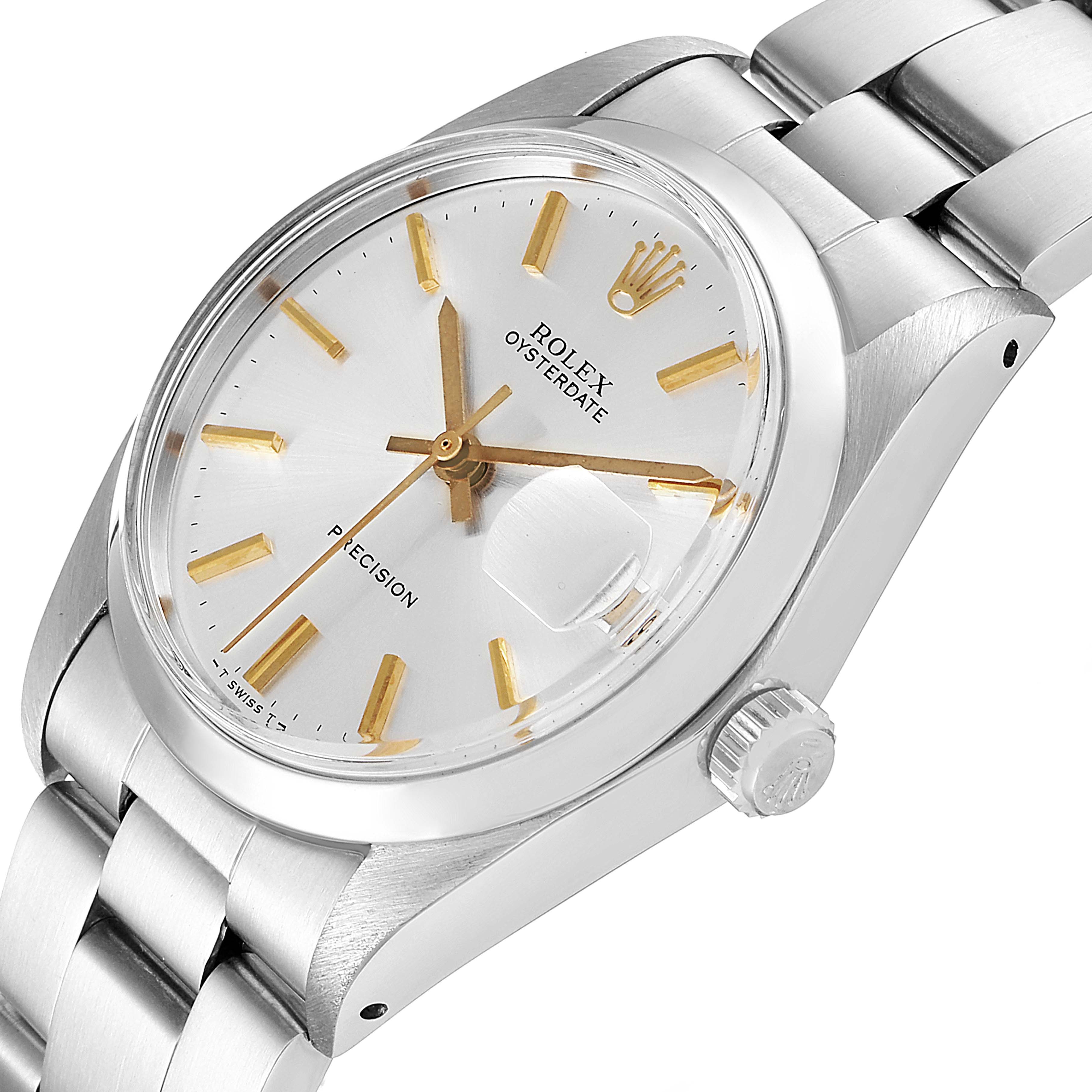 The image shows a close-up of a Rolex Vintage Collection 6694 Men
s Stainless Steel Silver Dial 6694 Men
s Stainless Steel Silver Dial watch, highlighting the dial, hands, crown, and part of the bracelet at an angled view.