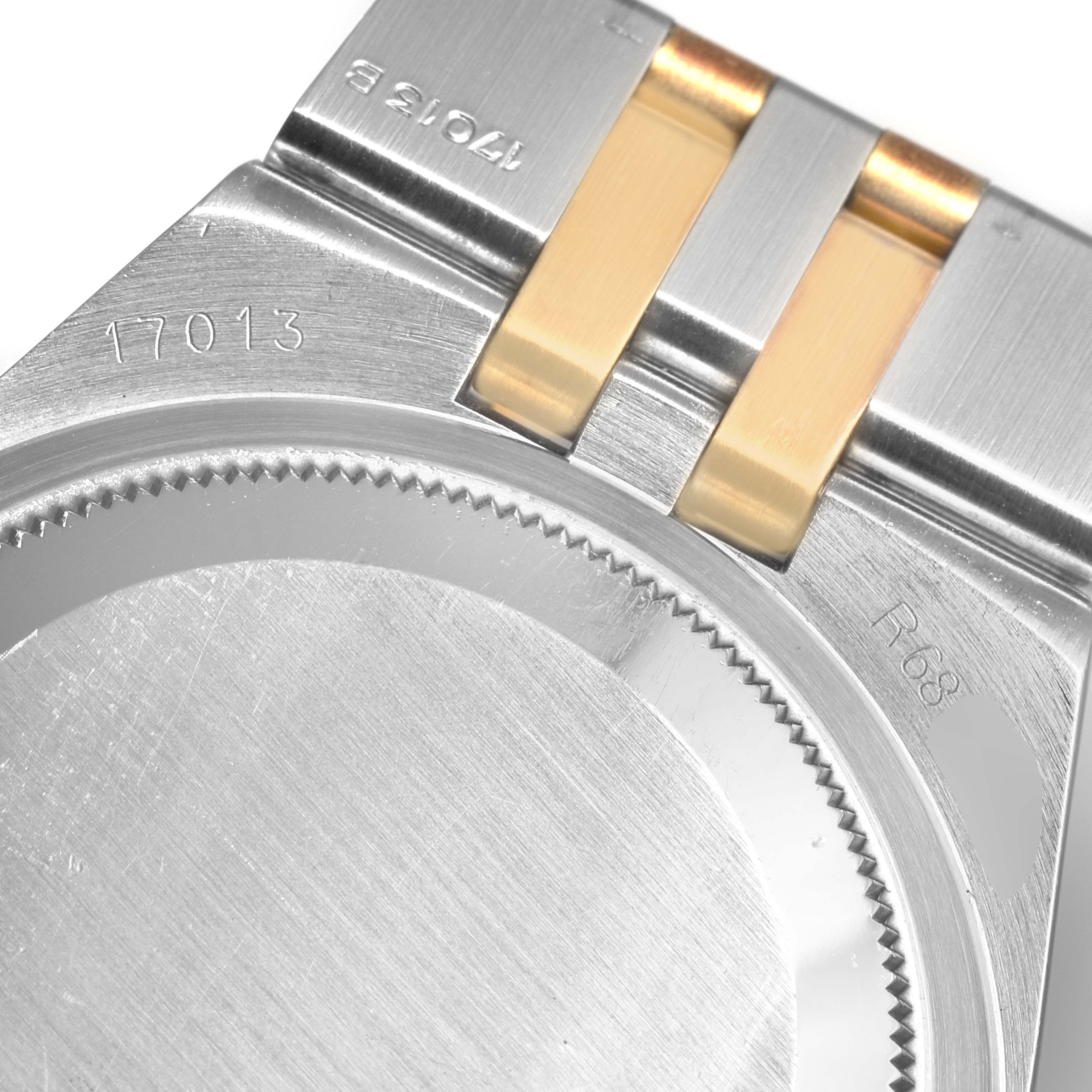 This image shows an angled close-up of the back case and bracelet attachment of a Rolex Oysterquartz 19508 Men
s Steel and Gold (two tone) Champagne Dial 19508 Men
s Steel and Gold (two tone) Champagne Dial model.