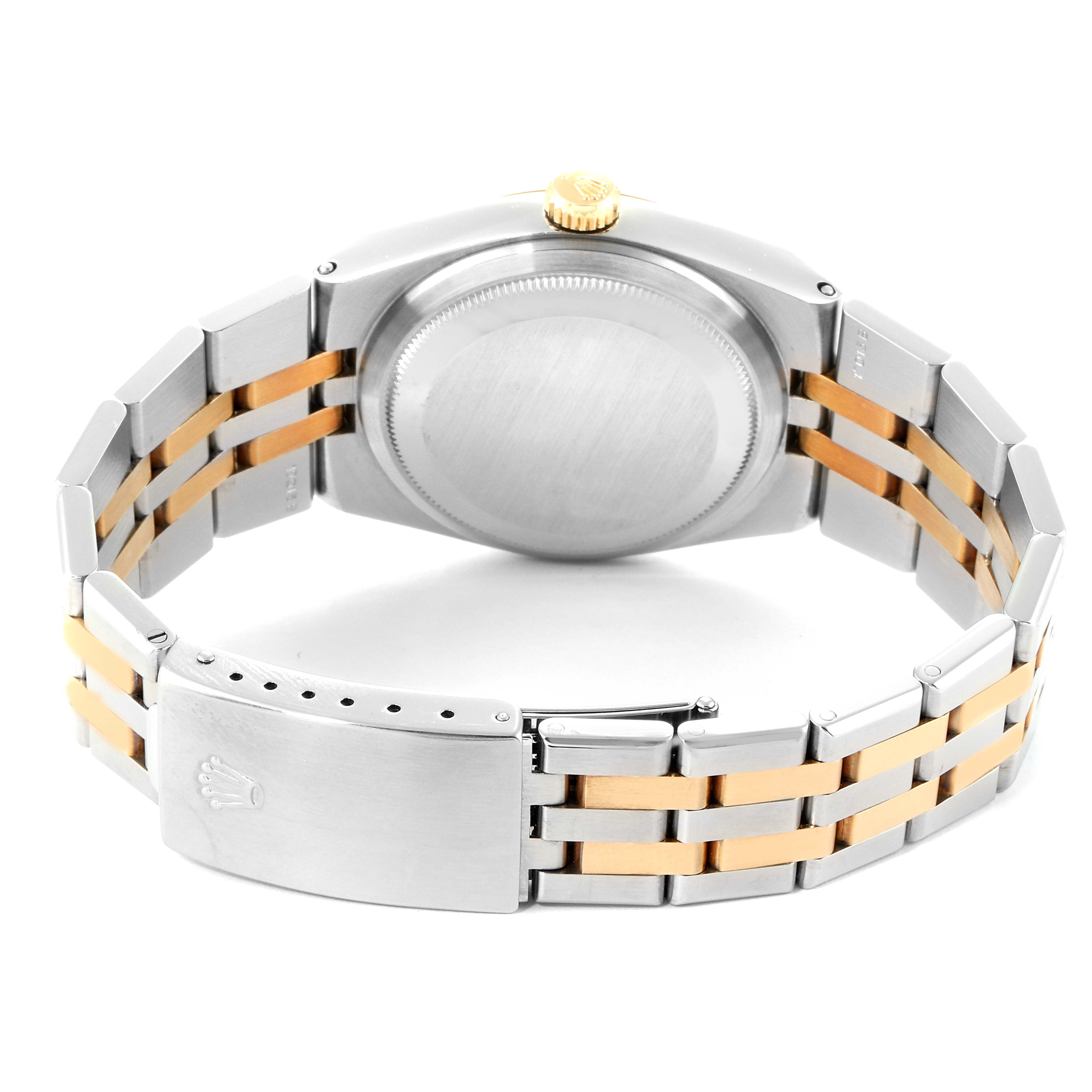 This image shows the back case and bracelet of the Rolex Oysterquartz 19508 Men
s Steel and Gold (two tone) Champagne Dial 19508 Men
s Steel and Gold (two tone) Champagne Dial watch, featuring a two-tone design with a clasp.