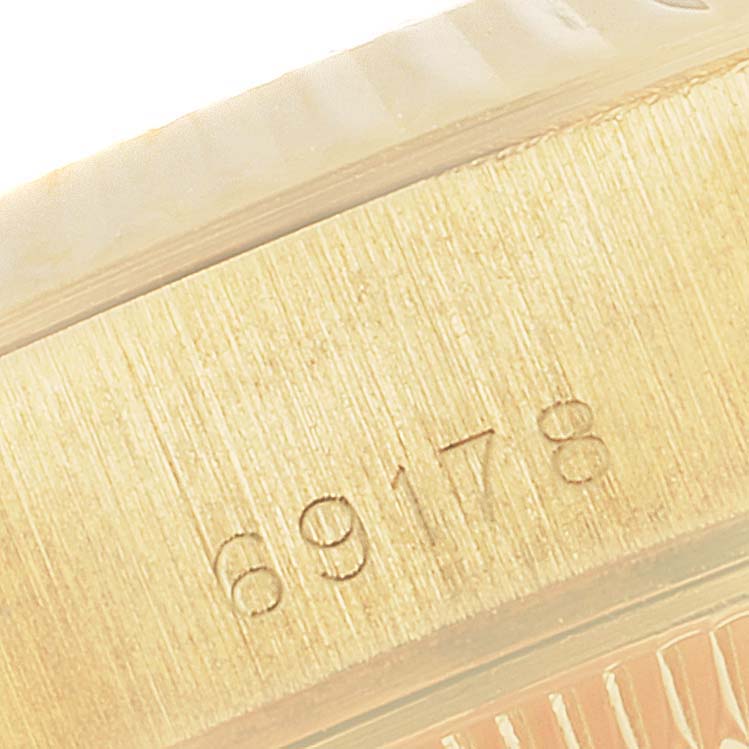 This image shows a close-up of the serial number engraved on the case of a Rolex President 69178 Women
s Yellow Gold Champagne Dial 69178 Women
s Yellow Gold Champagne Dial model watch.