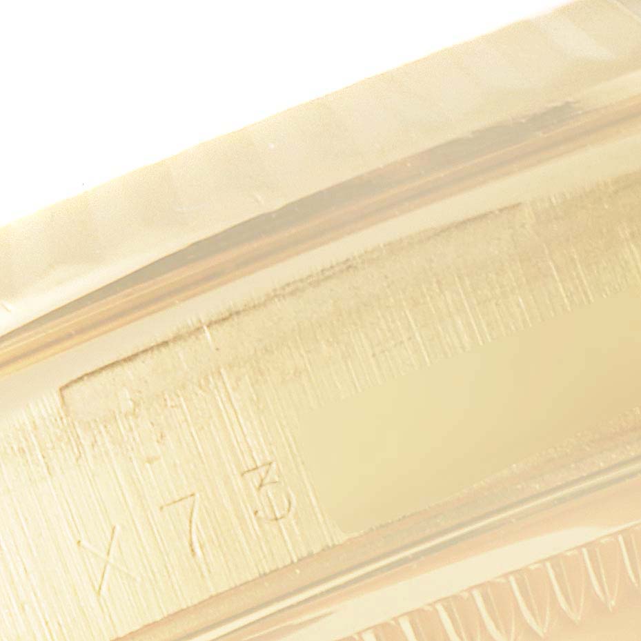 This close-up image shows the engraved edge of a Rolex President 18238 Men
s Yellow Gold Champagne Dial 18238 Men
s Yellow Gold Champagne Dial model watch.